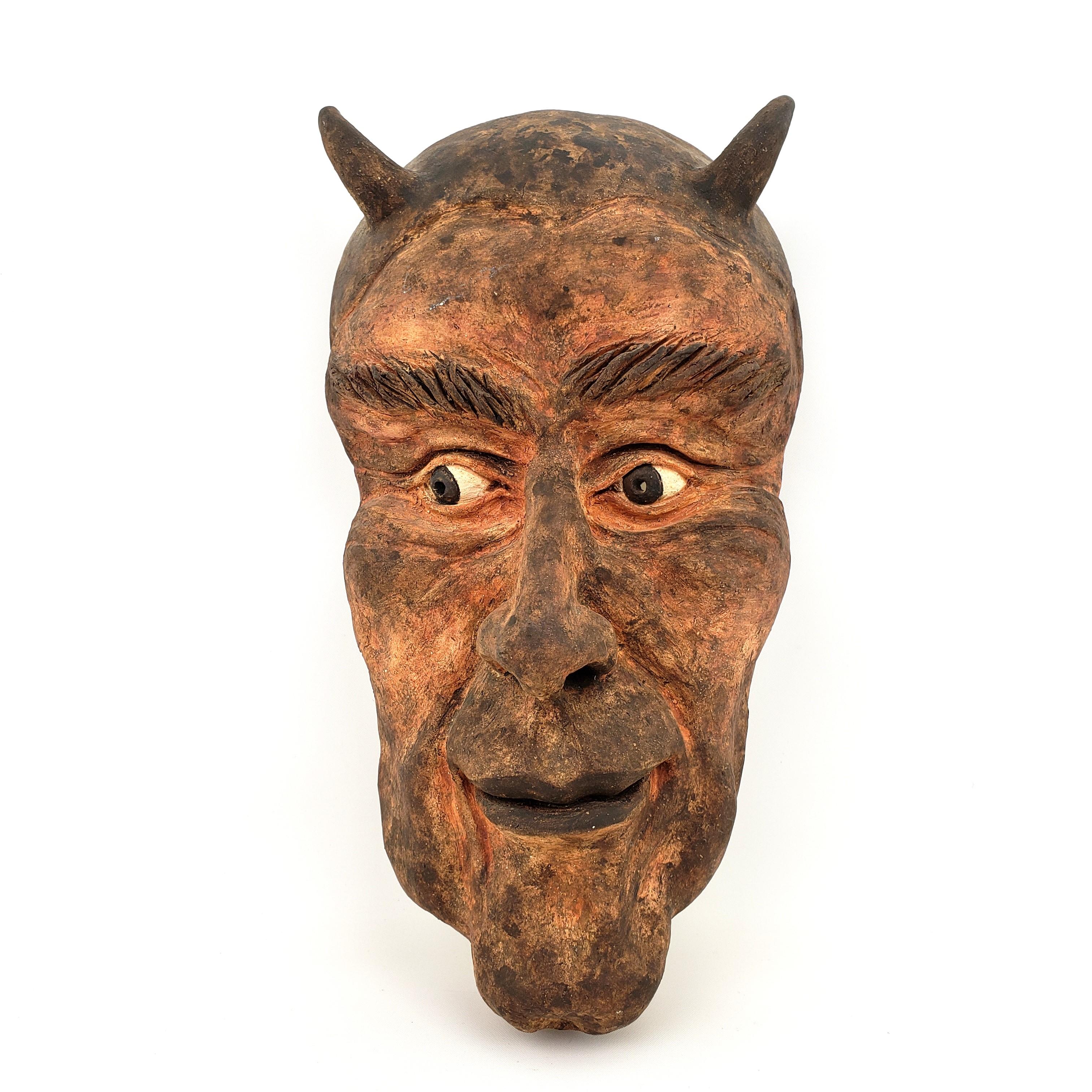 Art pottery wall mask with lifelike depiction of Lucifer.
