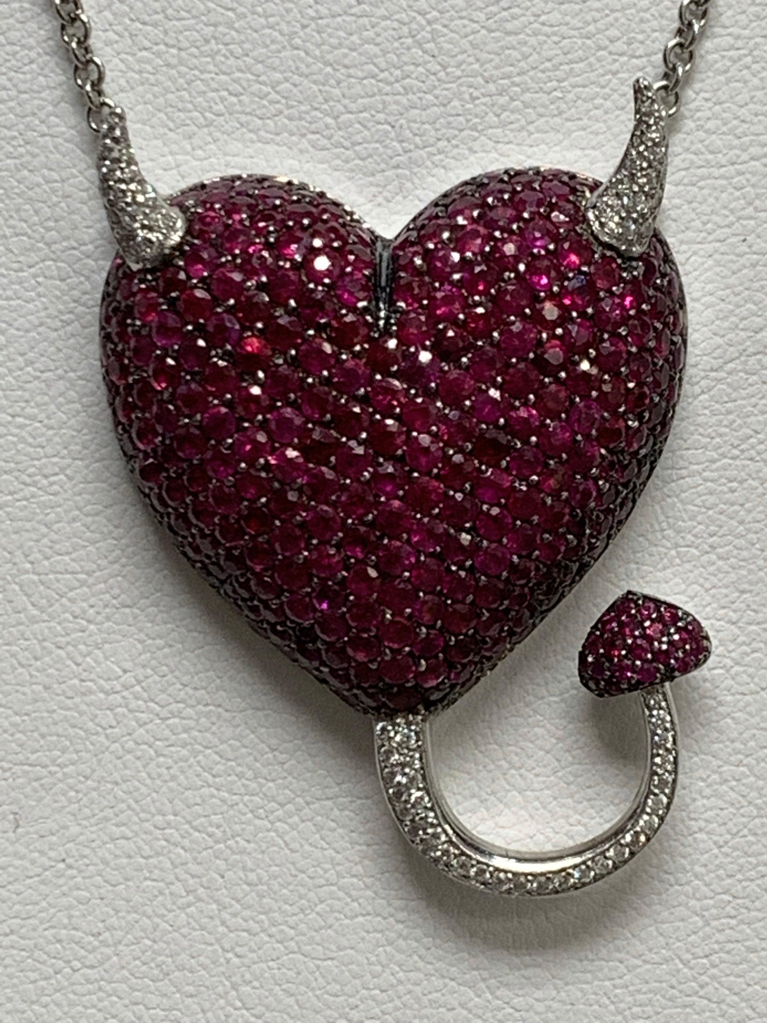 Ruby & Diamond Heart Necklace, 9.15 Carats

Featuring a Ruby & Diamond Heart Necklace with a total weight of 9.15 carats; Rubies, 8.78 carats; White Diamonds, 0.37 carats, set in 18K White Gold with Adjustable Chain, Size 14