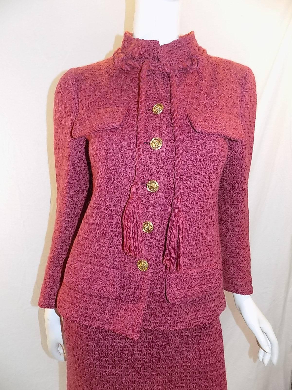 Truly beautiful 1979 Vintage Chanel skirt suit in raspberry color. Jacket is just Devine cut . Four front faux pockets with flops , gold buttons  and collar with braided rope finished with tassels . Silk lined . Two extra buttons included. quilted