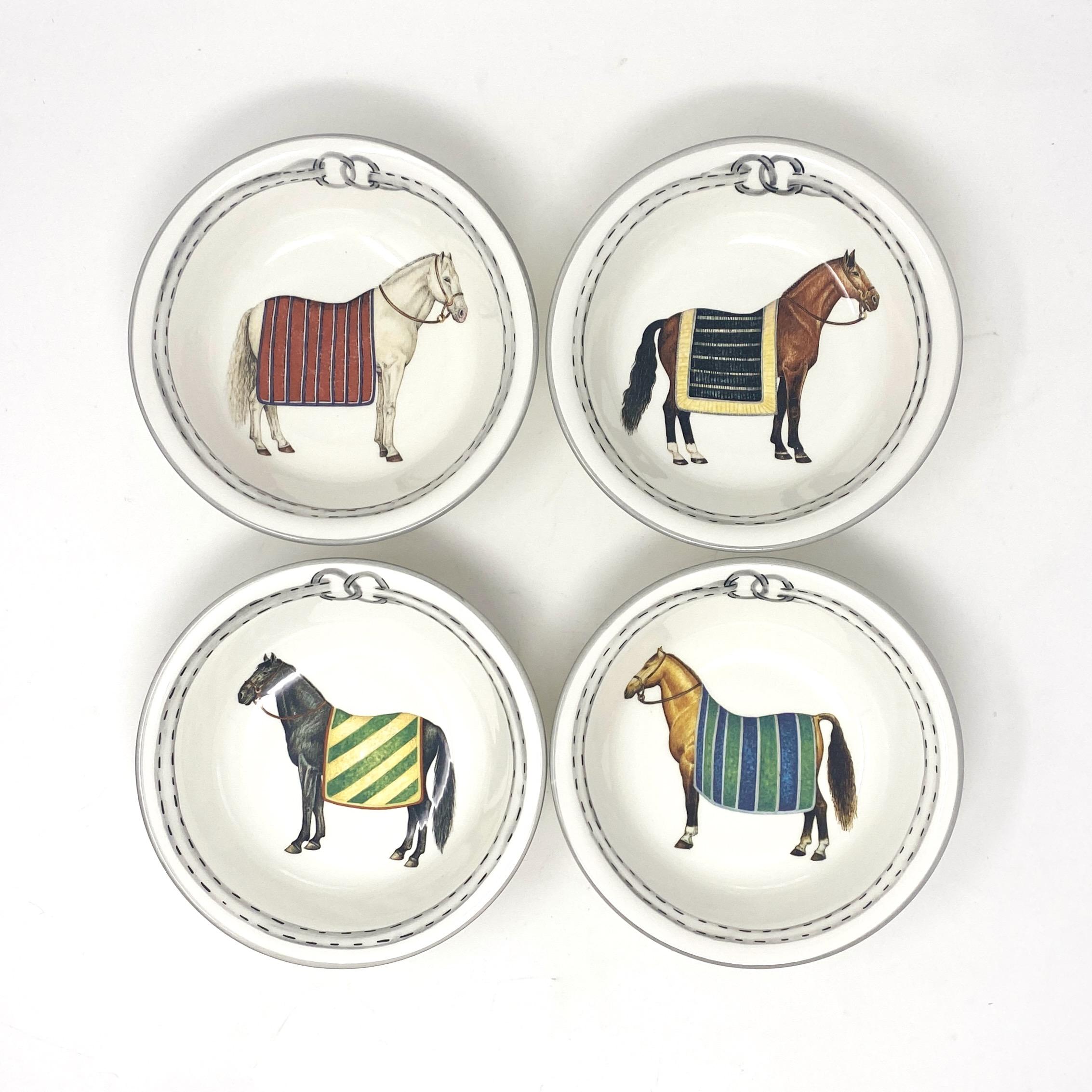 Equestrian Small Bowls, Set of 4. Each bowl features a unique blanketed horse. Made in Italy for The Mane Lion.

The Mane Lion was born in 1979 in the heart of Philadelphia's fabled Main Line, offering a line of charming, hand-painted chip-and-dip