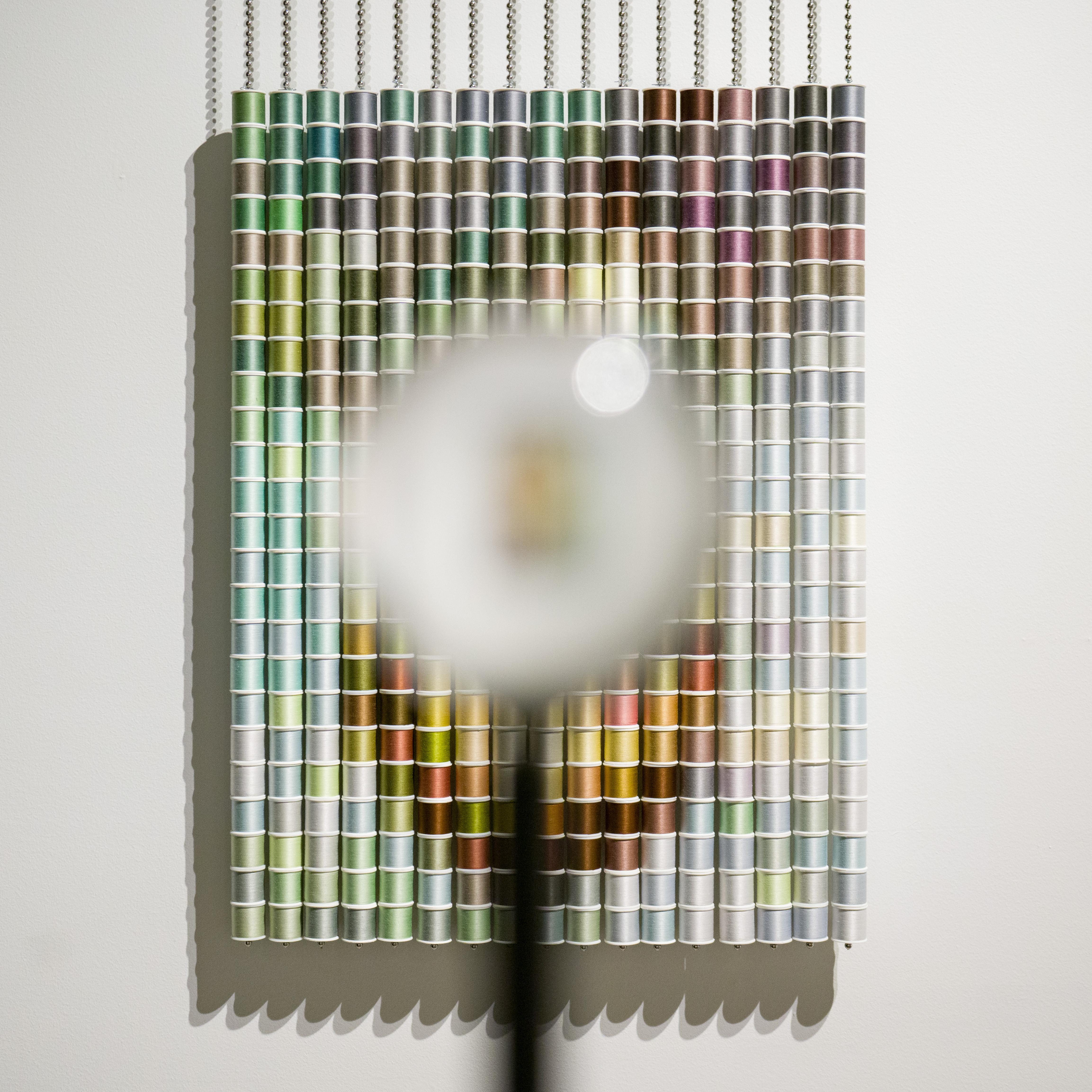 408 spools of thread, aluminum ball chain and hanging apparatus, clear acrylic sphere, steel stand, edition 4 of 5

Devorah Sperber’s work exists at the intersection of art, science, and technology.  Following the centuries-long tradition of