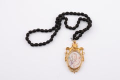 Devotional pendant, Virgin and Saint Joseph with Child. Gold, etc.