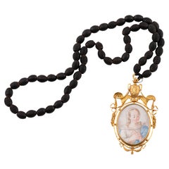 Devotional pendant, Virgin and Saint Joseph with Child. Gold, etc.