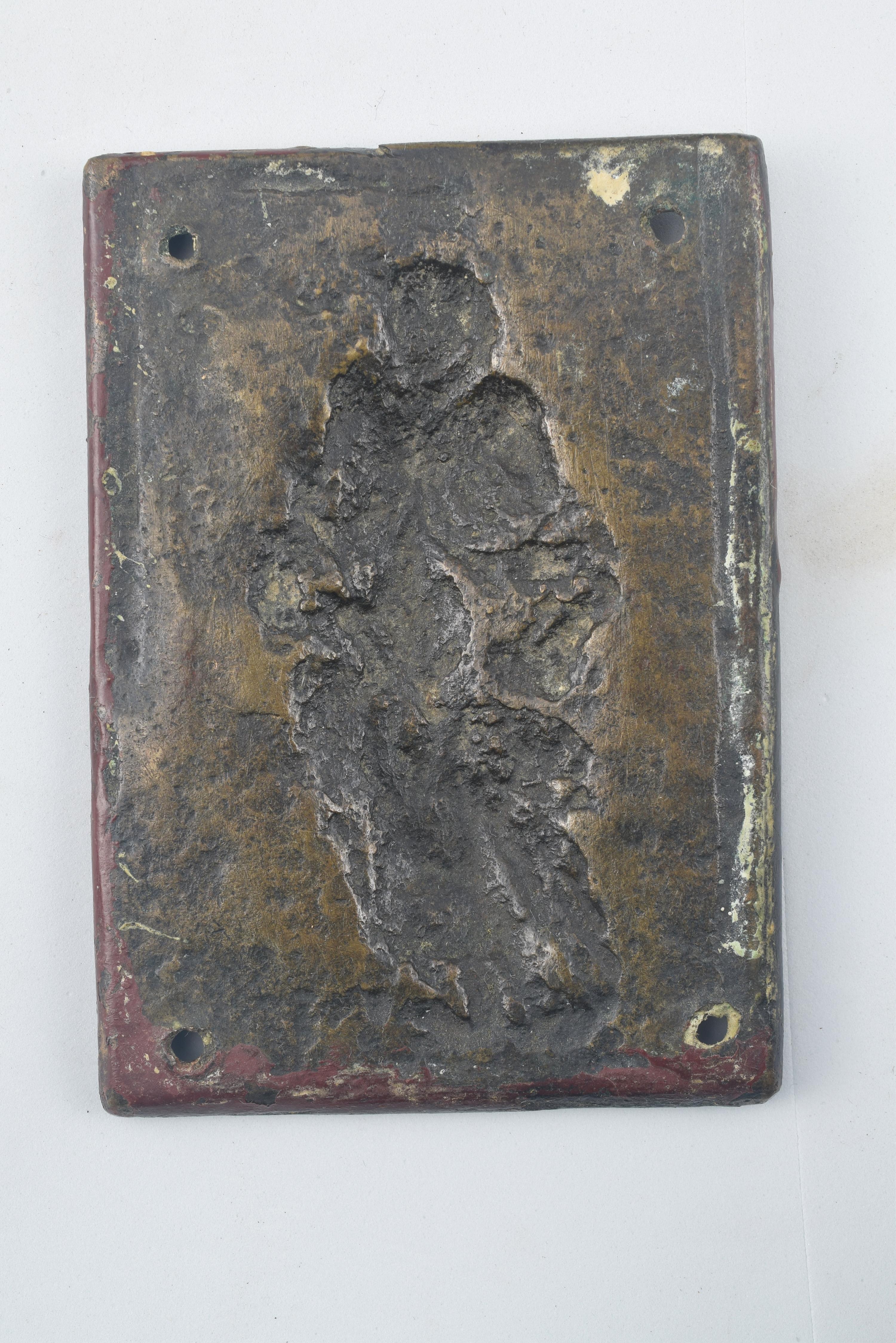 Devotional plaque, Saint Dominic. Bronze. Spanish school, 19th century. 
Devotional plate with a rectangular shape and made of bronze that has four holes in it and a figurative relief enhanced with a frame of smooth moldings. You can see a saint