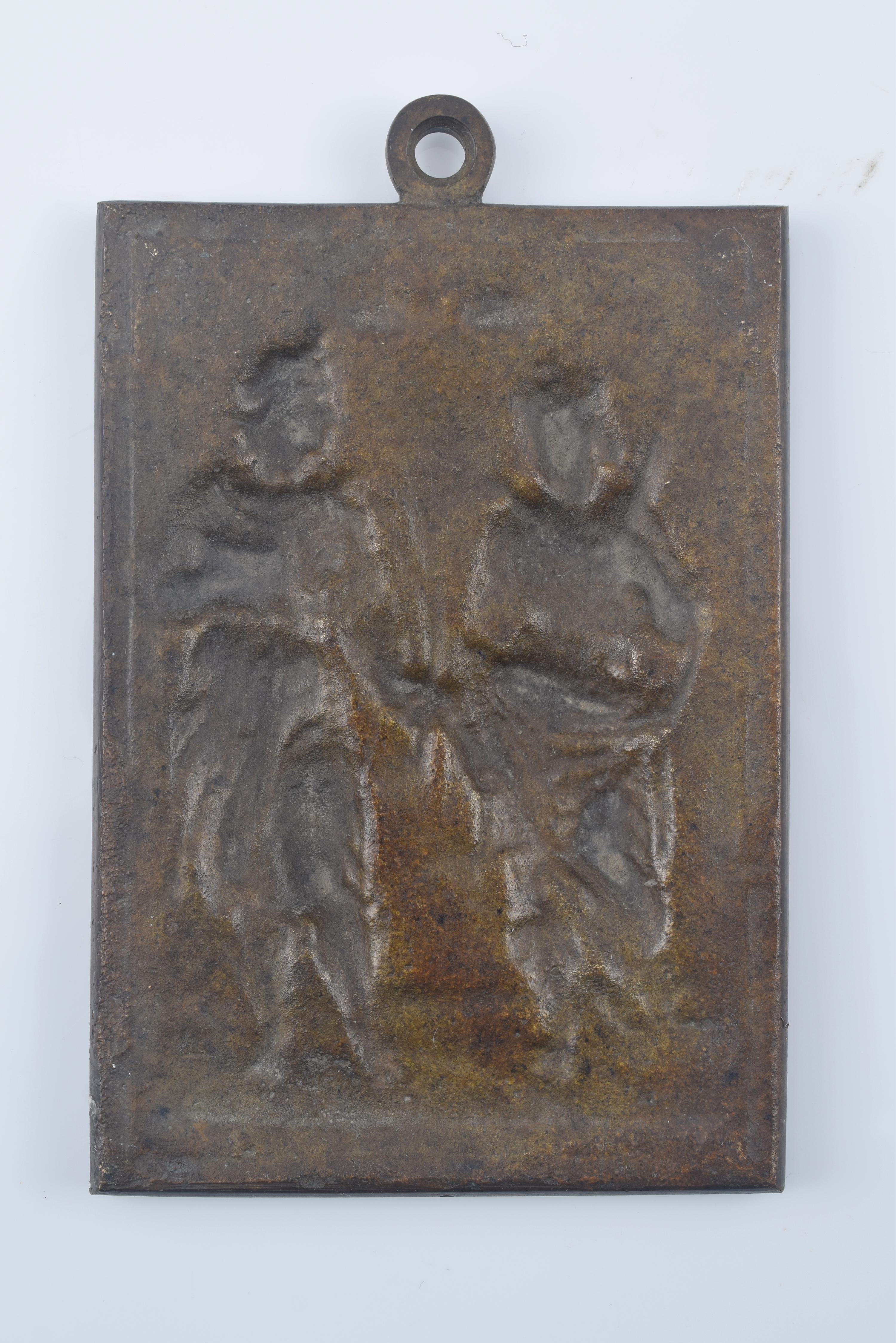 Devotional plaque, Holy Children Justo and Pastor. Bronze. Spanish school, 19th century. 
Bronze devotional plate with a rectangular shape that has a ring at the top and a frame of smooth moldings highlighting a figurative composition in relief. Two