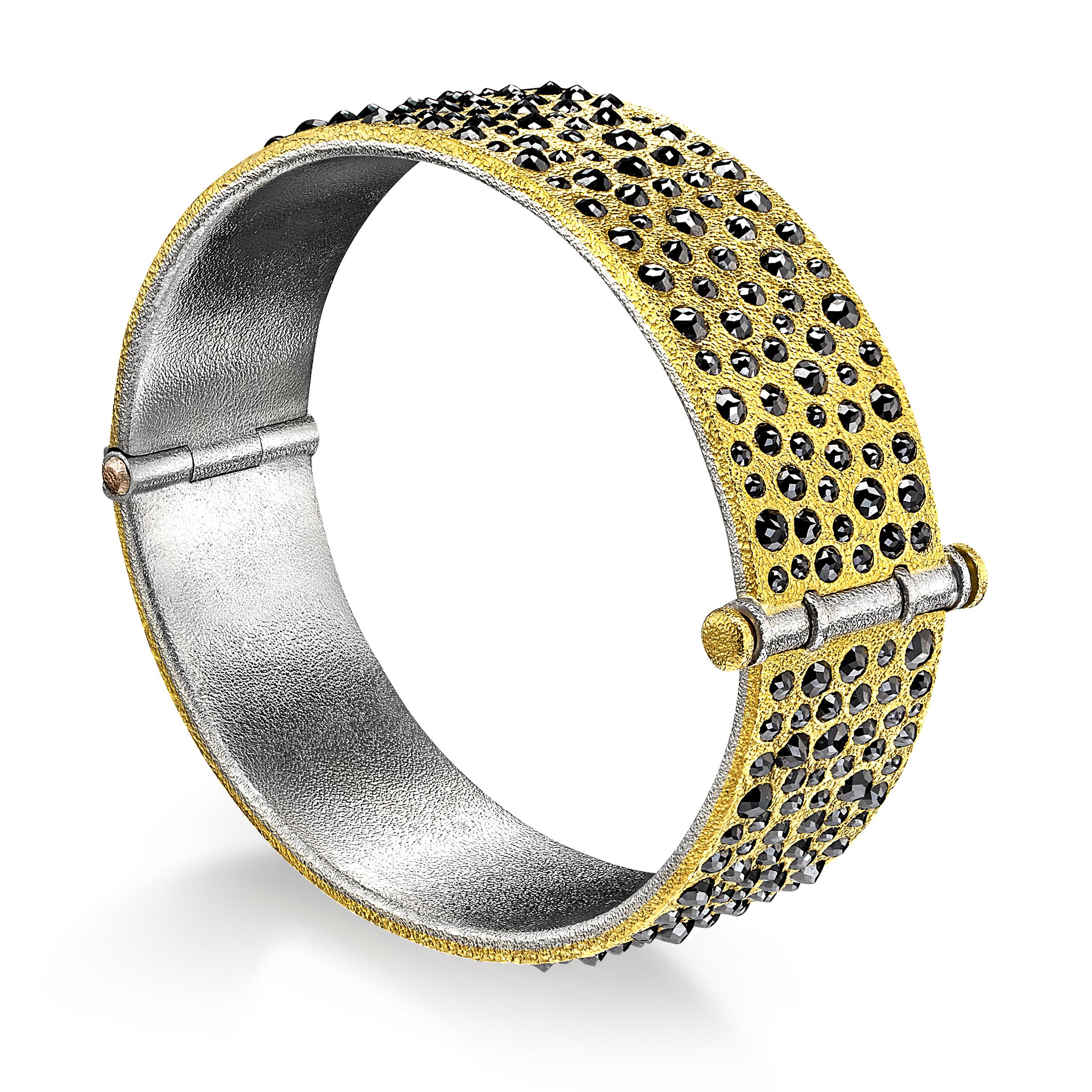 One of a Kind Bracelet hand fabricated by jewelry maker Devta Doolan featuring 10.31 carats of shimmering rose-cut black diamonds set inverted in Devta's signature-finished 22k yellow gold. The finely-textured gold is wrapped around a platinum