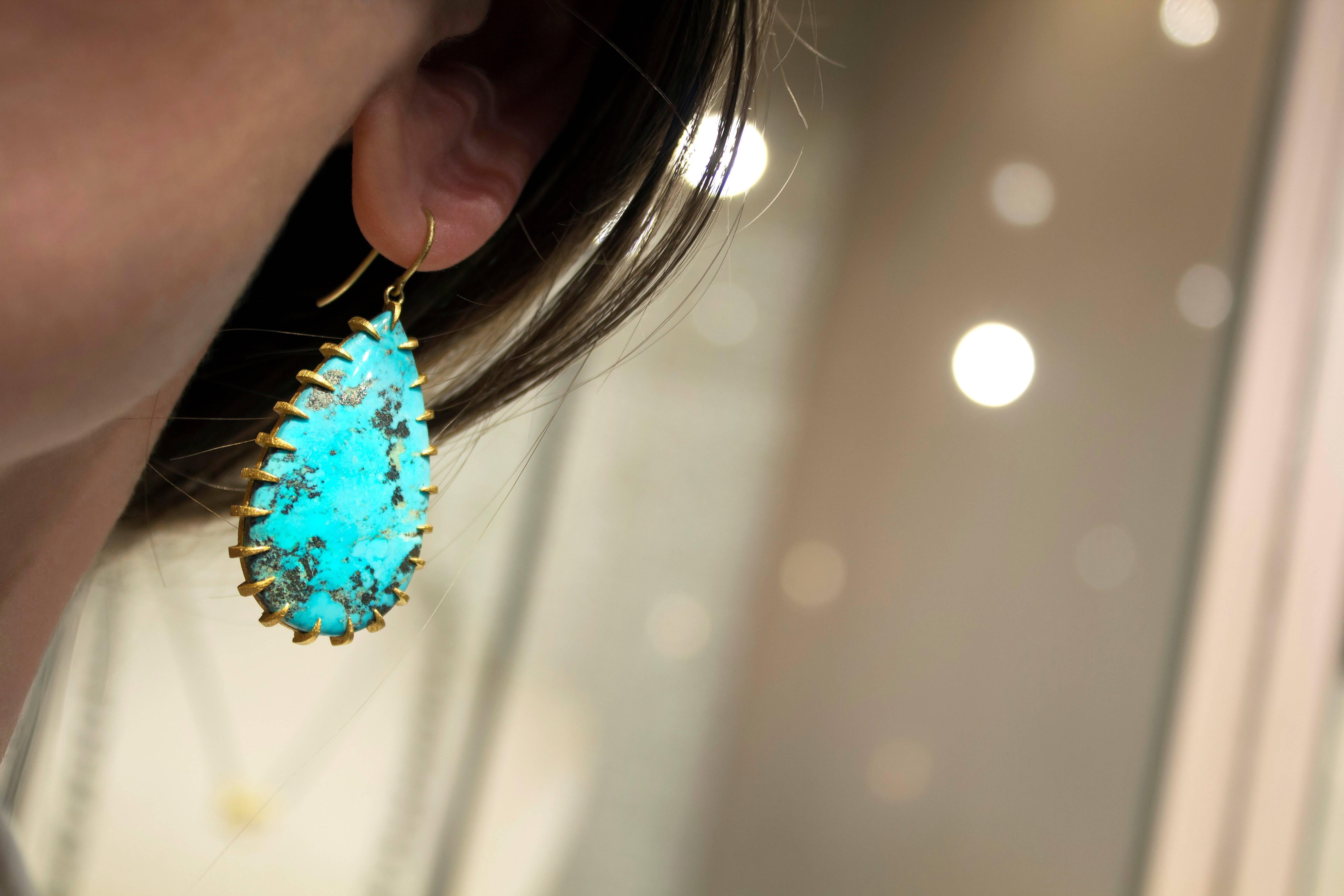 One of a Kind Golden Talon Drop Earrings handmade by acclaimed jewelry designer and artist Devta Doolan, showcasing a matched pair of superior-quality, 100% natural teardrop turquoise cabochons from the prized Morenci mine in Arizona, known from its