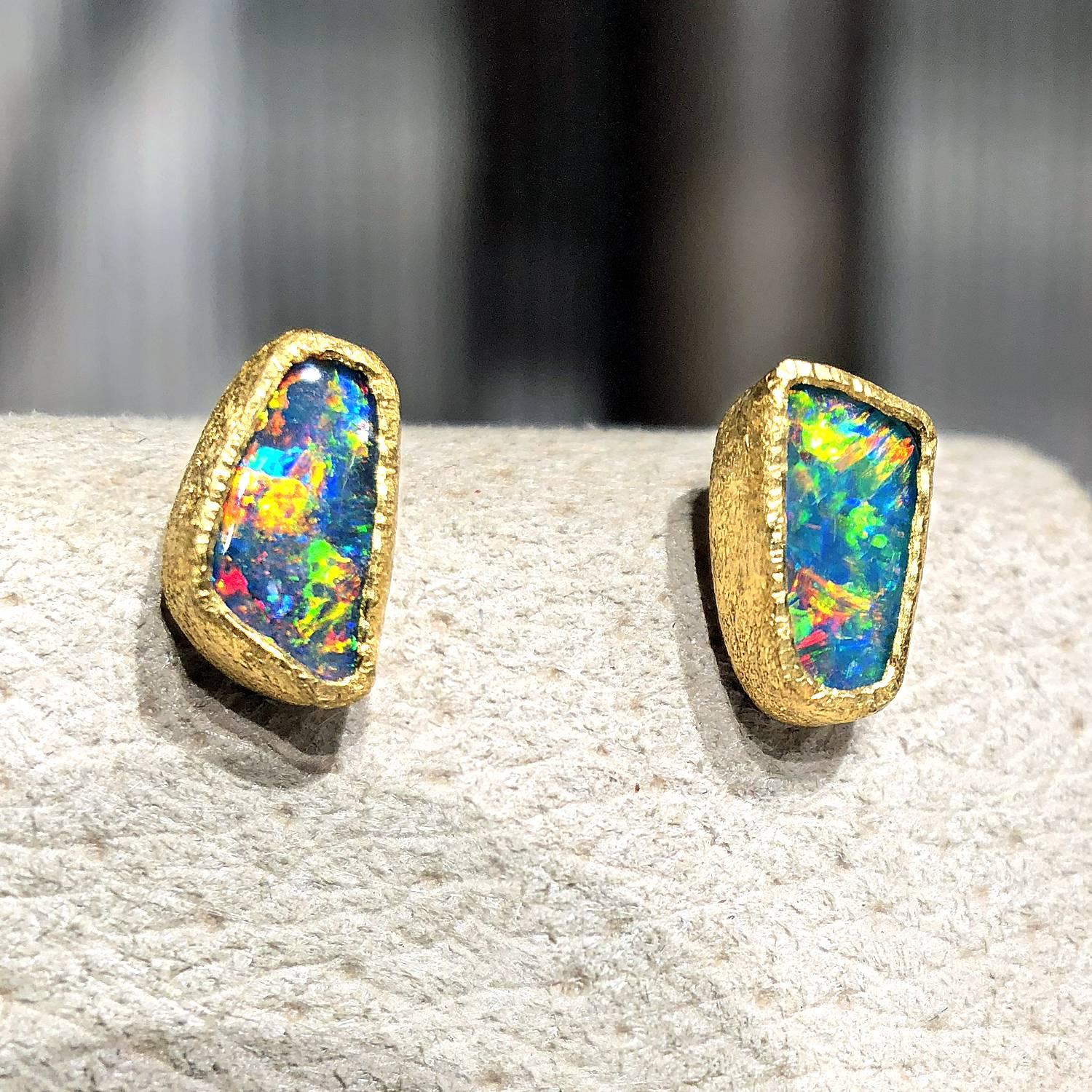 One of a Kind Stud Earrings handcrafted by acclaimed jewelry designer Devta Doolan with blue opal doublets exhibiting a vibrant multicolored confetti flash - primarily electrifying red fire with accents of green, orange, blue, yellow, violet, and