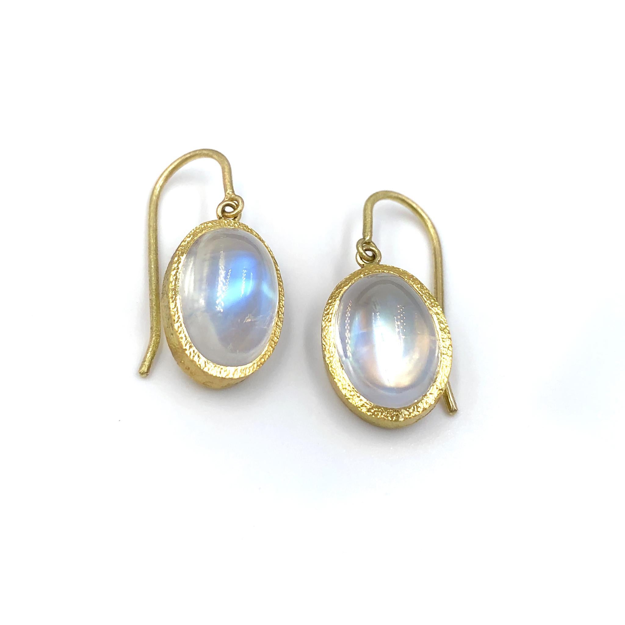 One of a Kind Earrings handcrafted by jewelry maker Devta Doolan in signature-finished 22k yellow gold showcasing a gorgeous matched pair of glowing rainbow moonstones, primarily exhibiting blue and green flash. Stamped 22k with the artist's