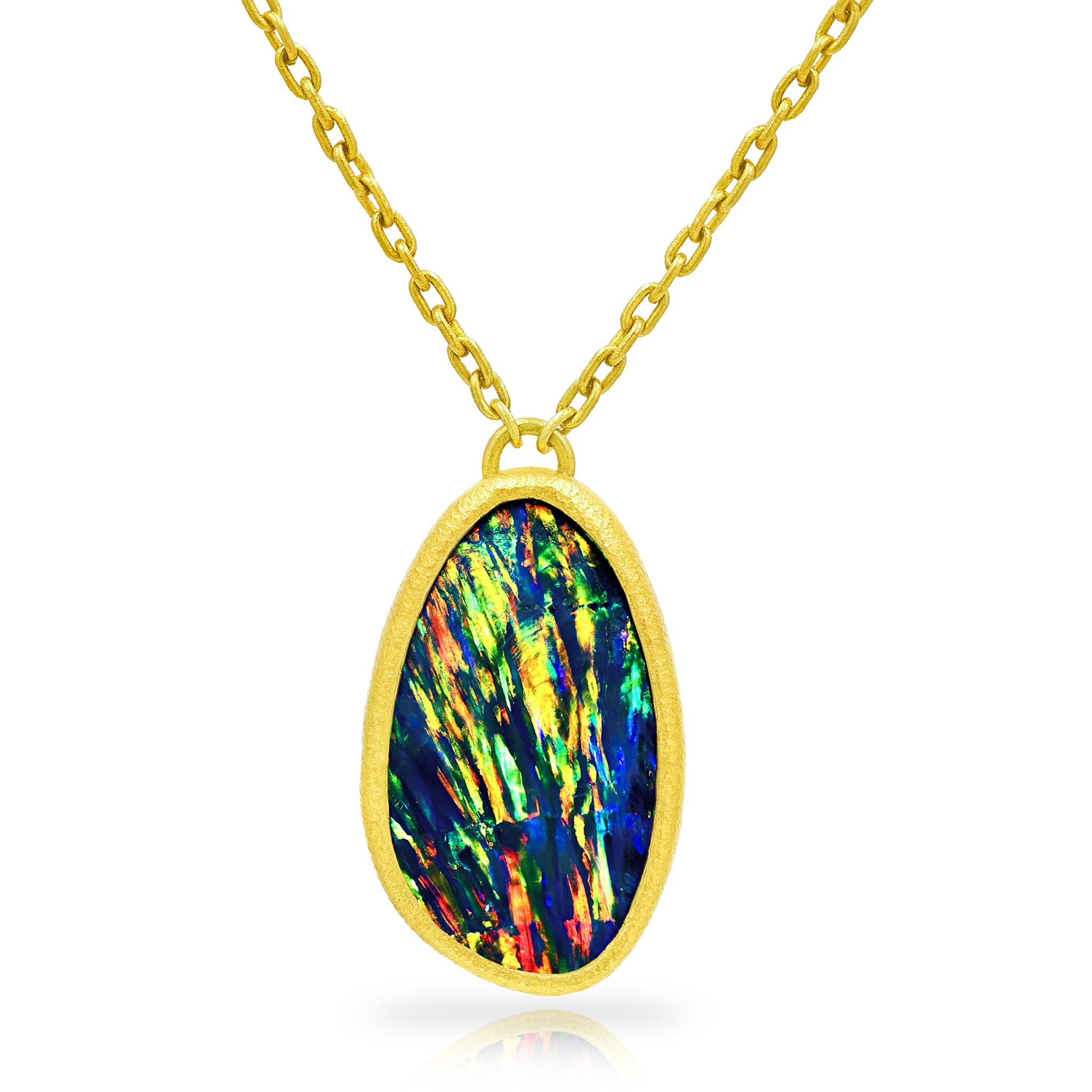 You have never seen an opal like this! Finest quality, rare gem black opal doublet one-of-a-kind drop necklace by acclaimed jewelry maker Devta Doolan hand-fabricated in the artist's signature, textured 22k yellow gold bezel setting and finished on