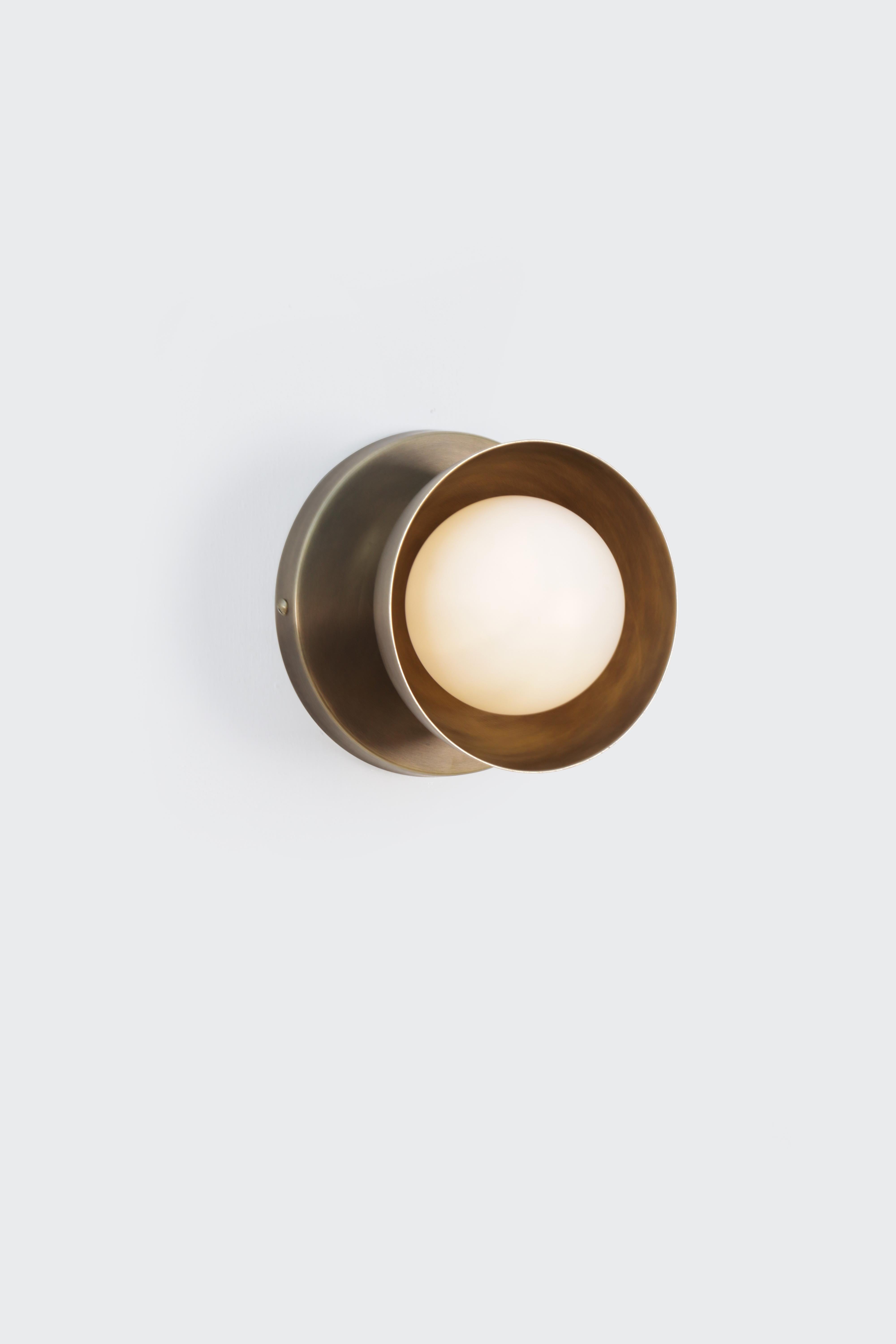 Dew Brass Dome Small Wall Sconce by Lamp Shaper
Dimensions: D 14.5 x W 16.5 x H 16.5 cm.
Materials: Brass and glass.

Different finishes available: raw brass, aged brass, burnt brass and brushed brass Please contact us.

All our lamps can be wired