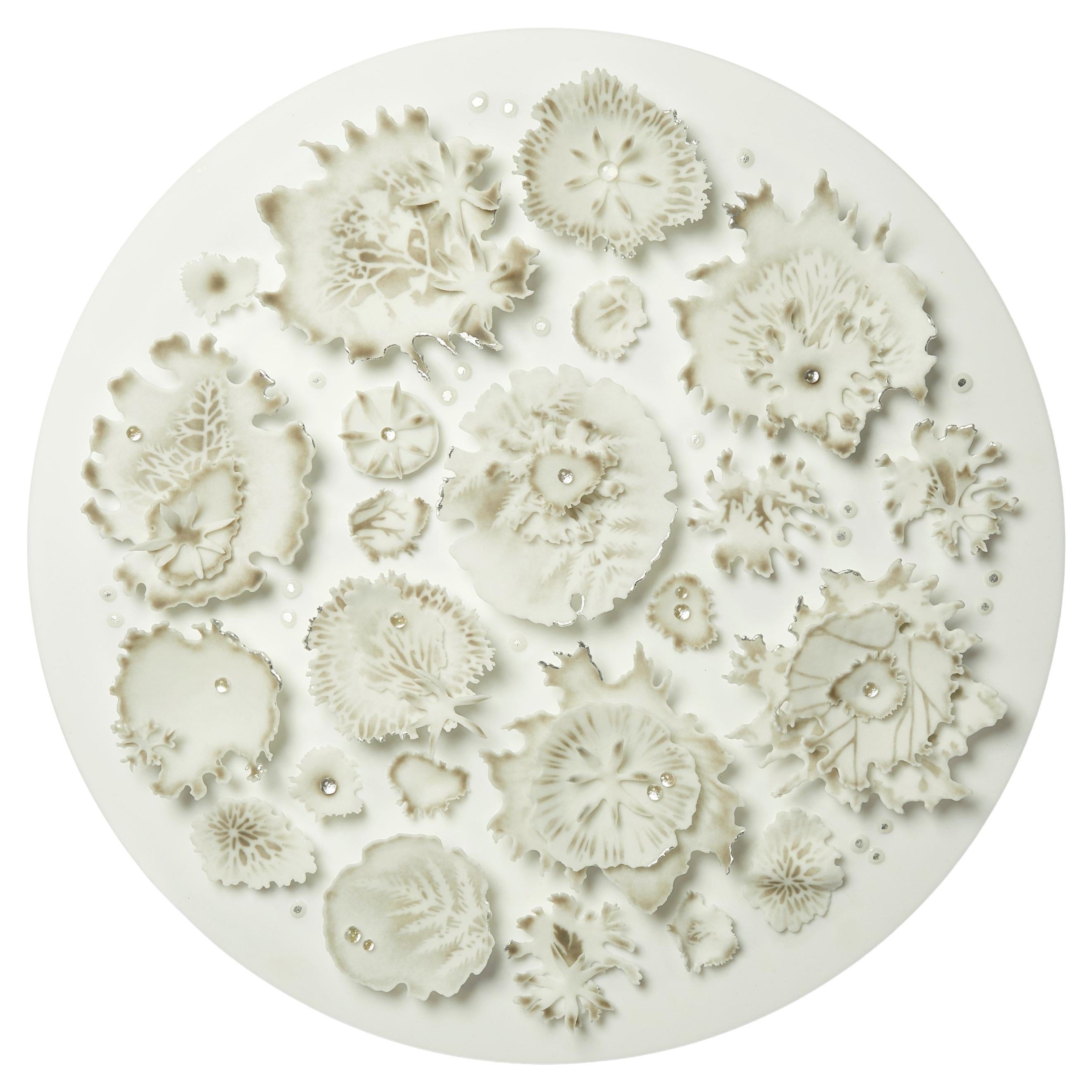Dew, white round glass artwork with silver & bronze details by Verity Pulford