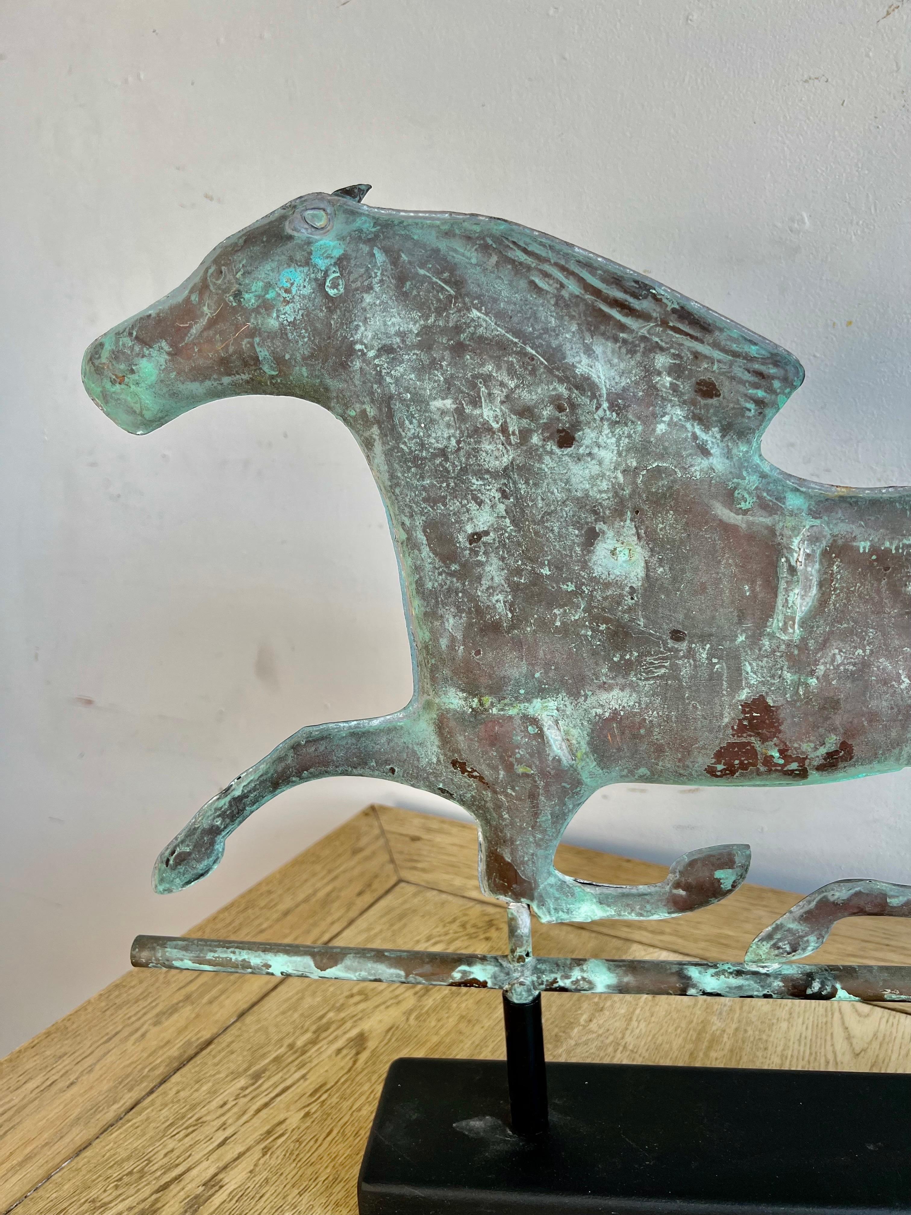 1930's Copper dexter horse from a vintage weathervane.  We mounted the beautiful copper horse on a rectangular wood base for display.  Beautiful vibrant colors of green throughout.