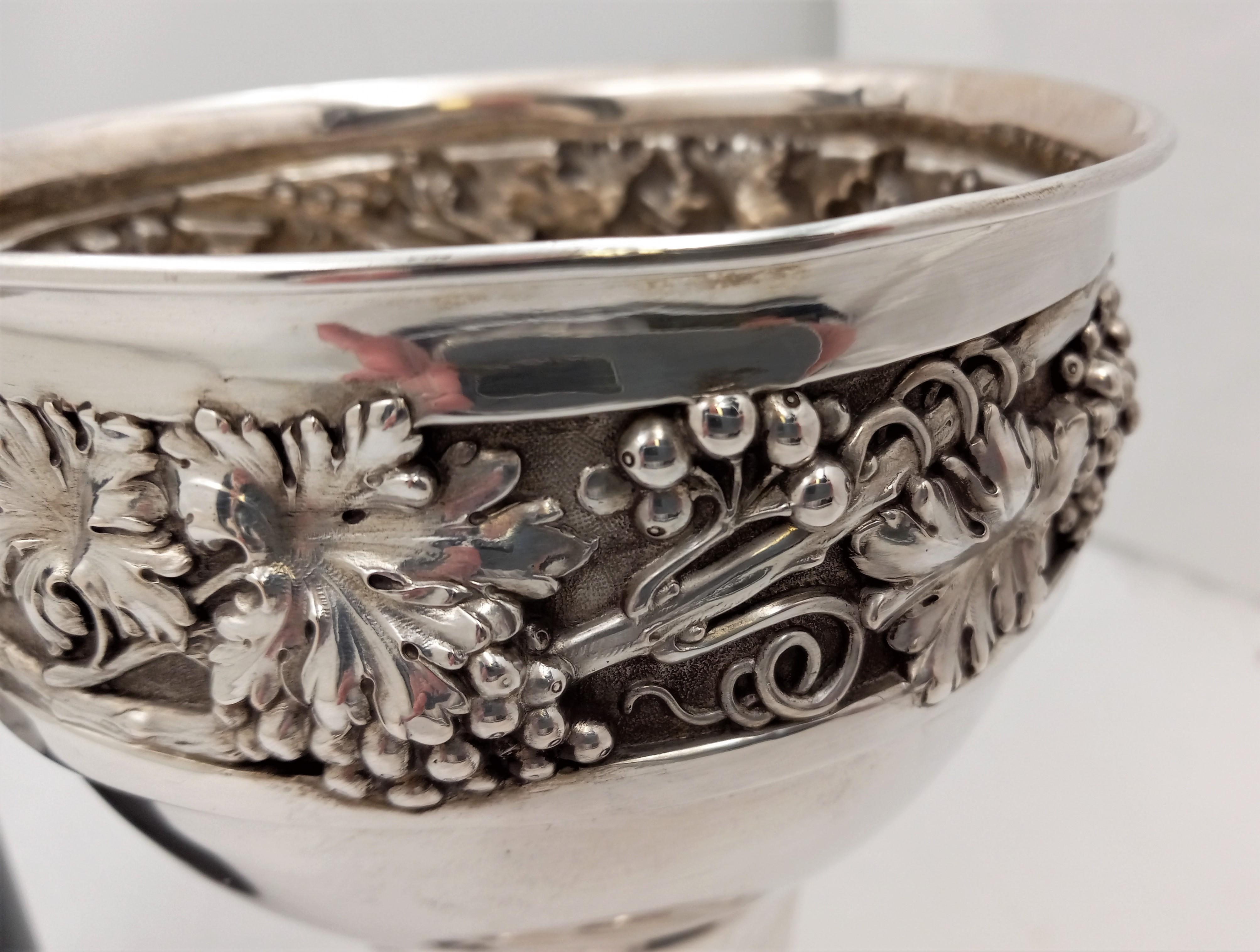 Deyhle German, late 19th or early 20th century 0.800 continental silver monumental wine goblet with an artistically twisted, fluted stem, and highly realistic grape and vine motifs as a frieze. It measures 7 1/2'' in height by 5 1/2'' in diameter at