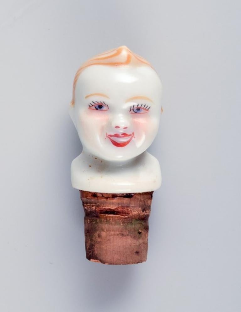 French D.F. Limoges, France. Porcelain baby warming bowl. Stopper with a child's face. For Sale