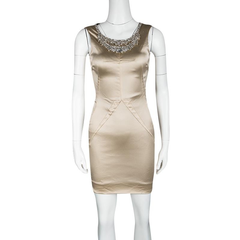 Add the right blend of sheen and bling to your party and special event looks wearing this D&G dress that will not go unnoticed. The soft beige satin fabric adds that perfect sheen to its body hugging silhouette while the crystal embellishments