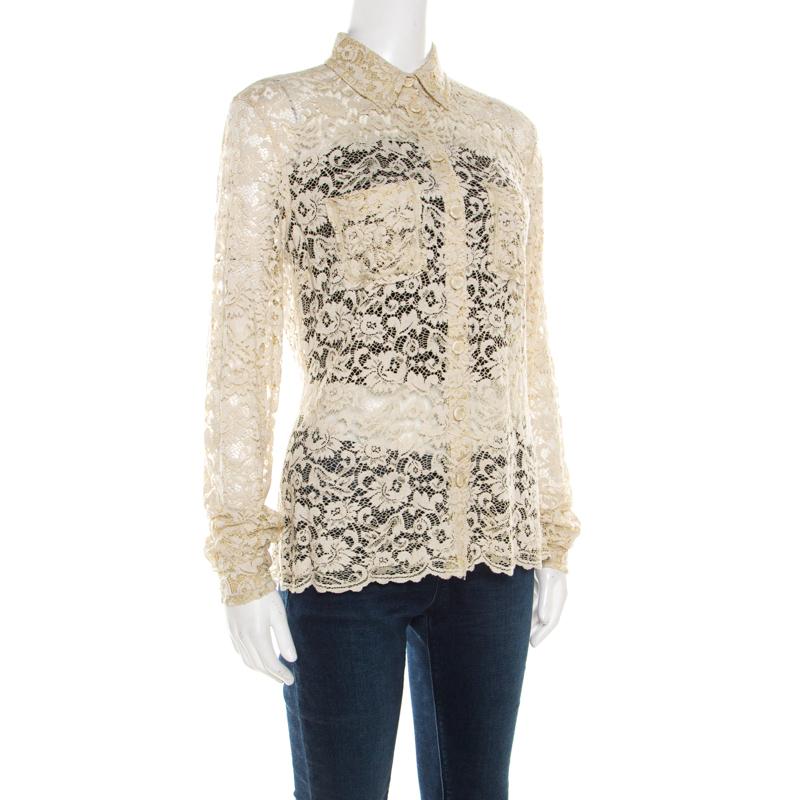 Simply delightful, this blouse from D&G is a must buy! The beige creation is made of a viscose blend and features a floral lace design. It flaunts sharp collars, front button fastenings, long sleeves and scalloped bottom trims. It will look great