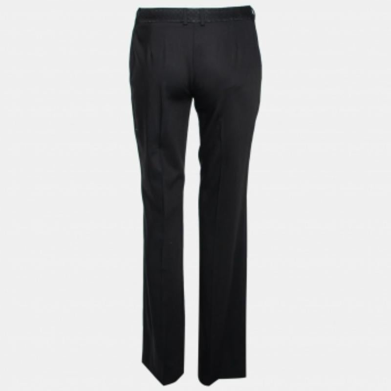 Created from a mix of quality products, this pair of D&G tapered pants will make you look your best. The black design is highlighted with striking detailing at the waist and is styled with button closure, belt loops, and two external pockets. Team