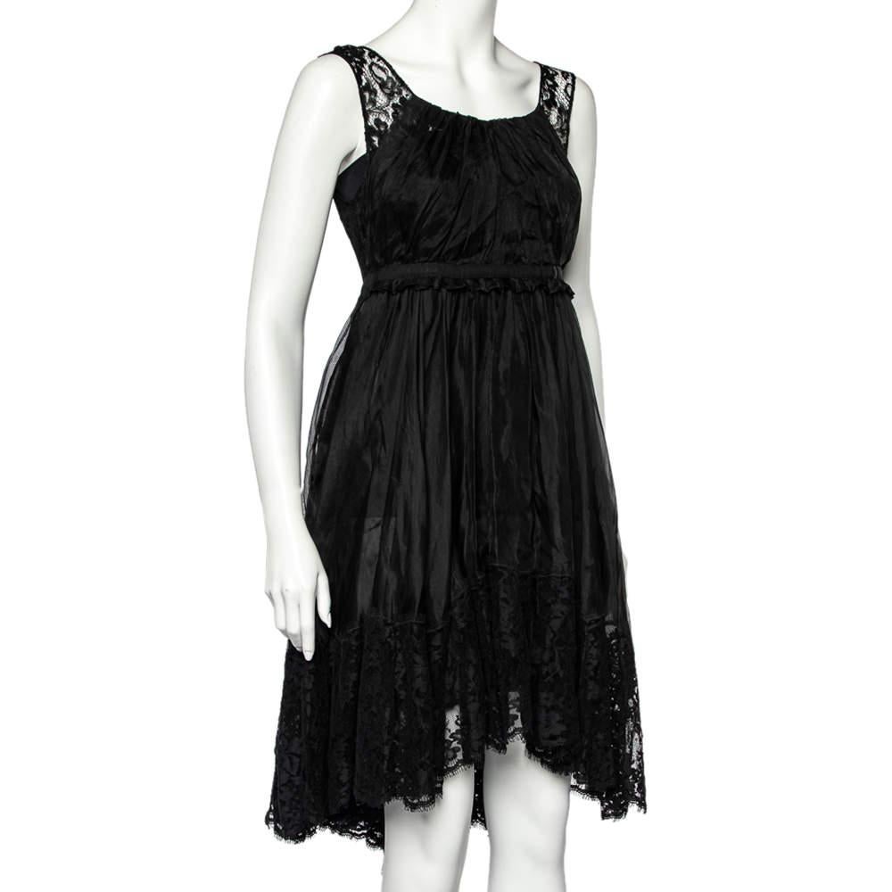 A dress like this one from D&G is perfect for a host of occasions. It has been crafted from sheer silk and carries a classic black hue. It has lace trims, a sleeveless silhouette and a zip closure. Pair it with heels and shimmering accessories.

