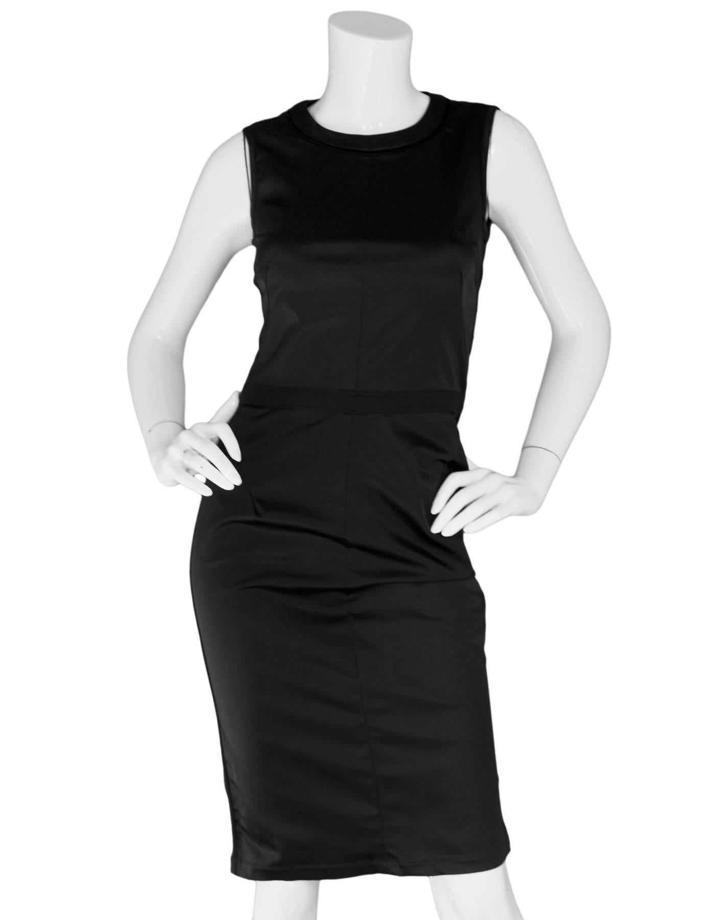 D&G Black Sleeveless Dress Sz IT40

Made In: Romania
Color: Black
Composition: 63% polyamid, 26% acetate, 11% elastane
Lining: Black textile
Closure/Opening: Back zip closure with strap across back
Exterior Pockets: None
Interior Pockets: