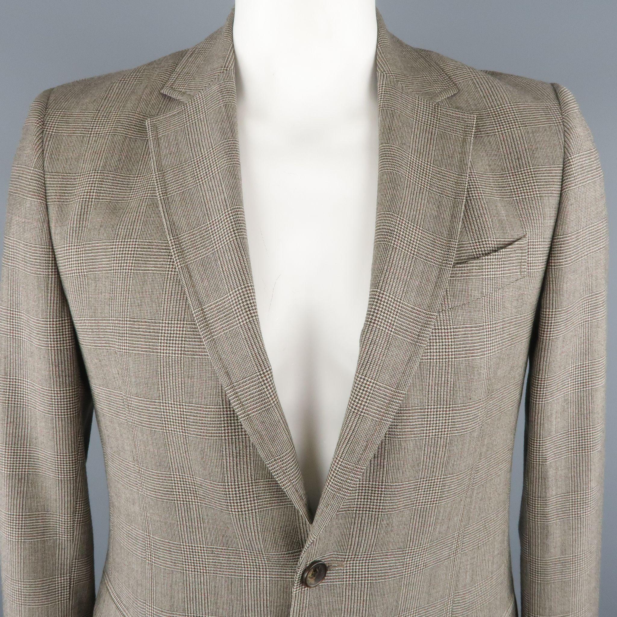 D&G by DOLCE & GABBANA Sport Coat comes in black and white tones in a glenplaid wool material, with a notch lapel, 2 buttons closure, single breasted, slit and flap pockets with a single vent at back. Made in Italy.
 
Excellent Pre-Owned
