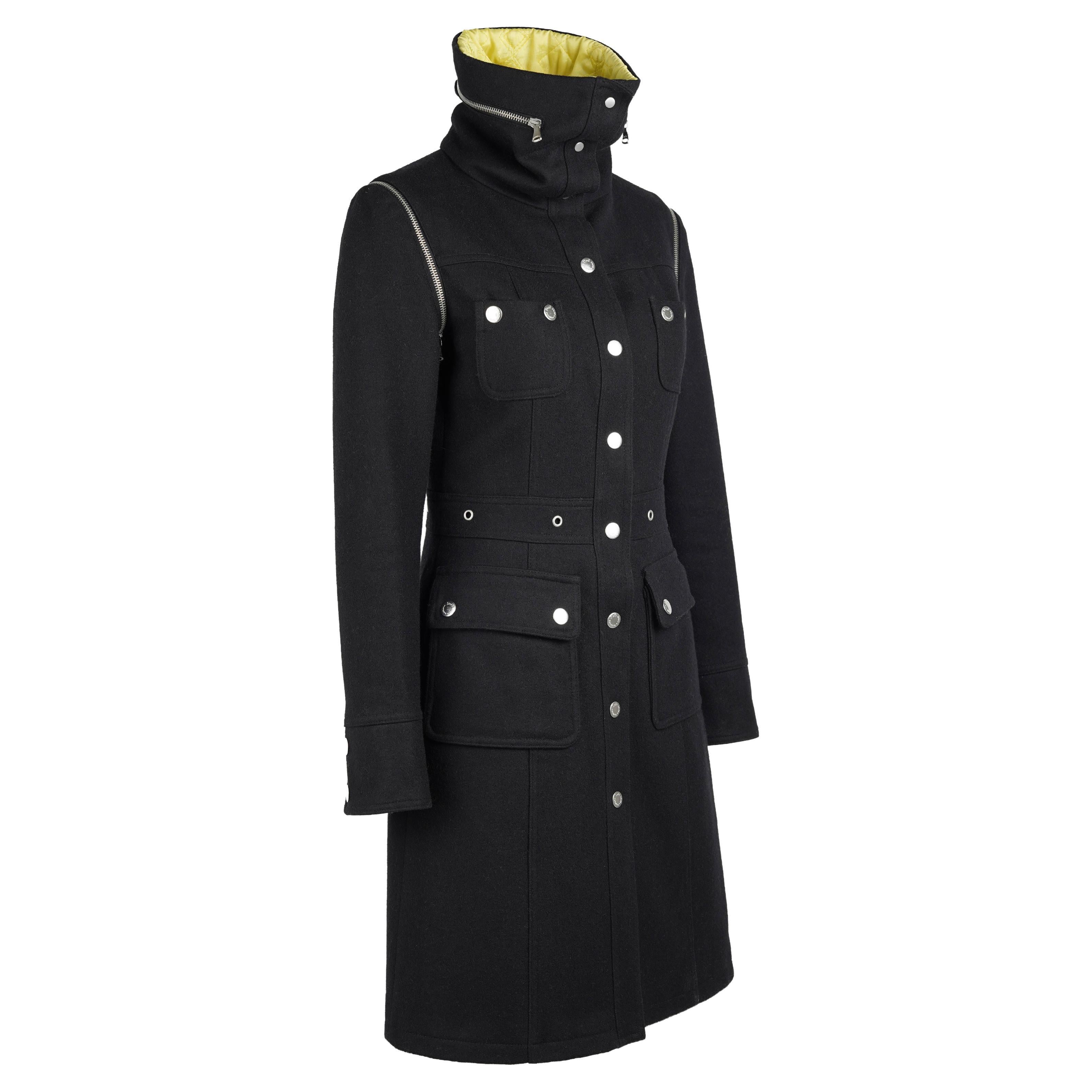 An iconic piece from Dolce & Gabbana’s Fall/Winter 2003 collection, this D&G coat exemplifies early-2000s Italian tailoring infused with the brand’s signature utilitarian edge. Expertly made in Italy by ITTIERRE S.p.A., it blends structure,