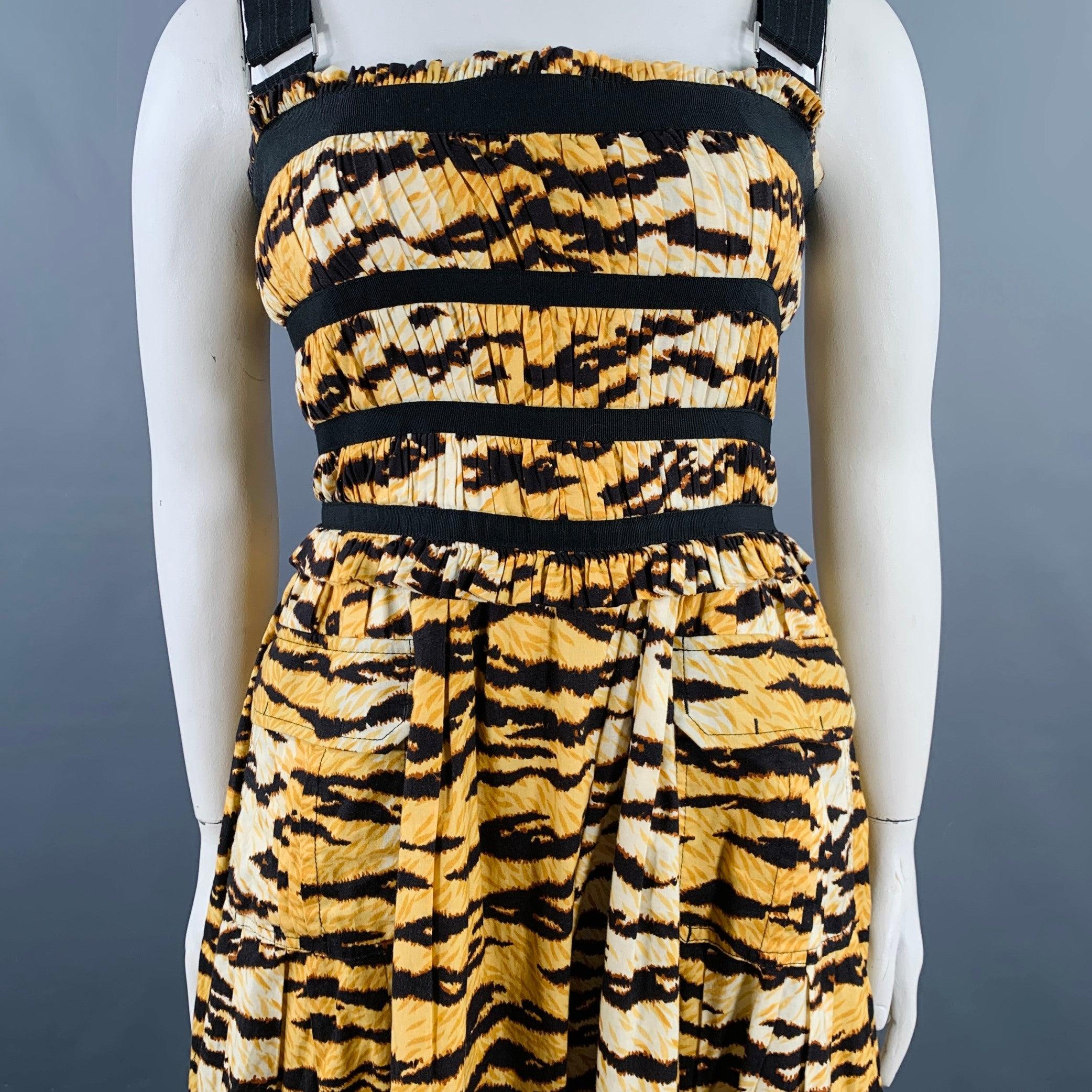 D&G by DOLCE & GABBANA dress
in a yellow and black cotton blend featuring a tiger stripe print, two buttoned flap pockets, and adjustable black ribbon straps.Excellent Pre-Owned Condition. 

Marked:   IT 48 

Measurements: 
 
Shoulder: 14 inches
