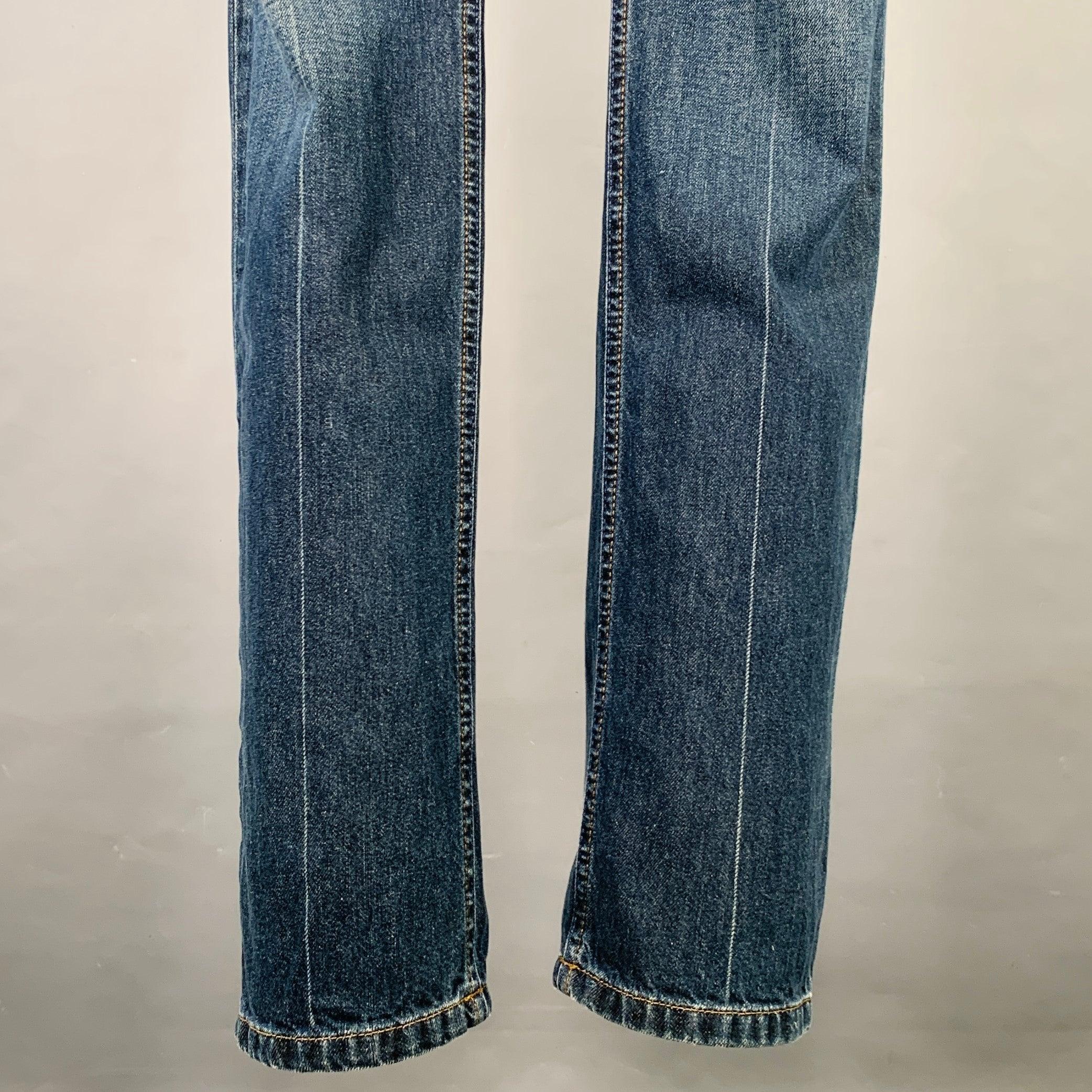 D&G by DOLCE & GABBANA jeans
in a blue cotton denim featuring a low rise style, skinny fit, and zip fly closure.Excellent Pre-Owned Condition. 

Marked:   35 

Measurements: 
  Waist: 35 inches Rise: 7 inches Inseam: 34 inches 
  
  
 
Sui Generis