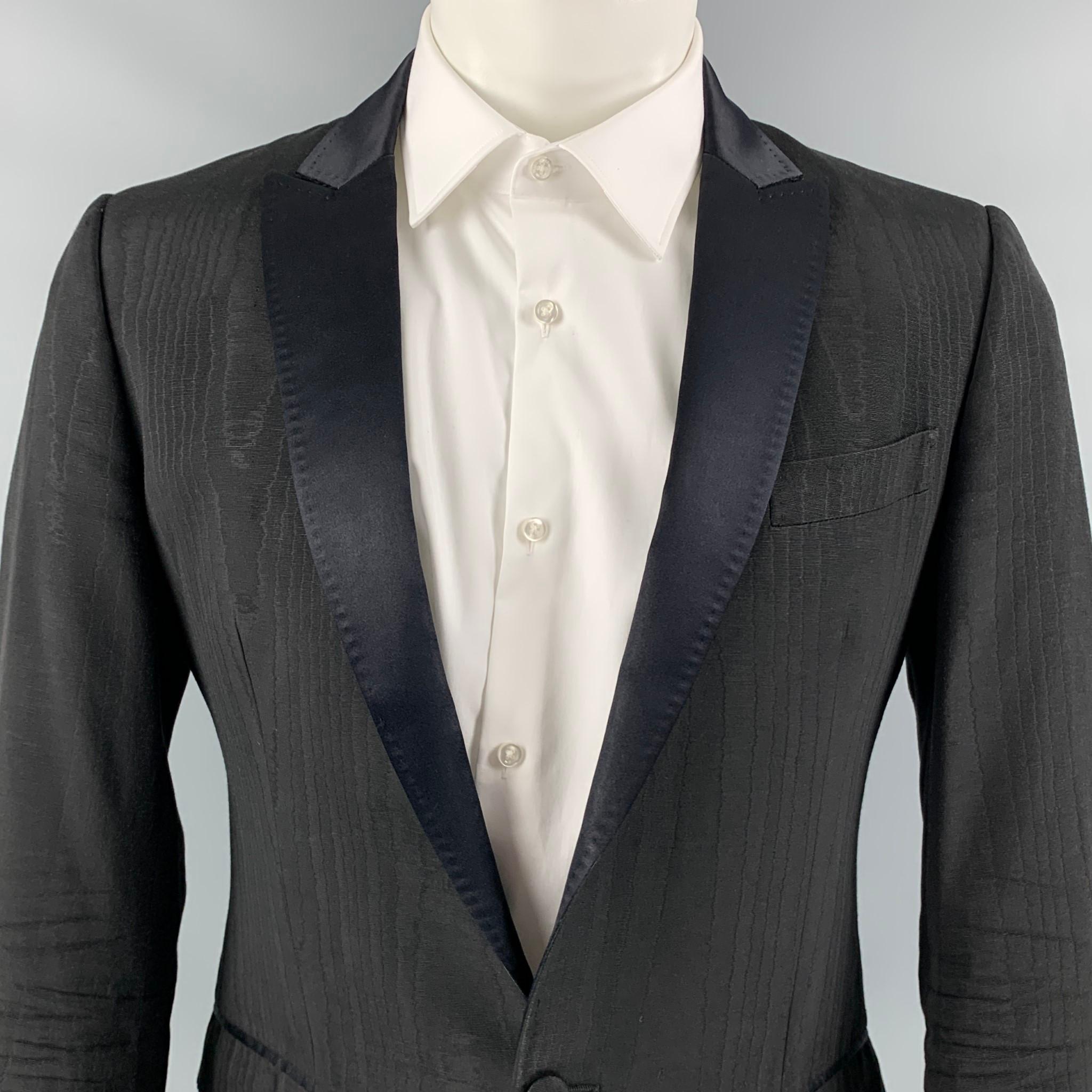 D&G by DOLCE & GABBANA sport coat comes in a black jacquard acetate blend with a full liner featuring a peak lapel, flap pockets, and a single button closure. Made in Italy. 

Very Good Pre-Owned Condition.
Marked: 46

Measurements:

Shoulder: 17