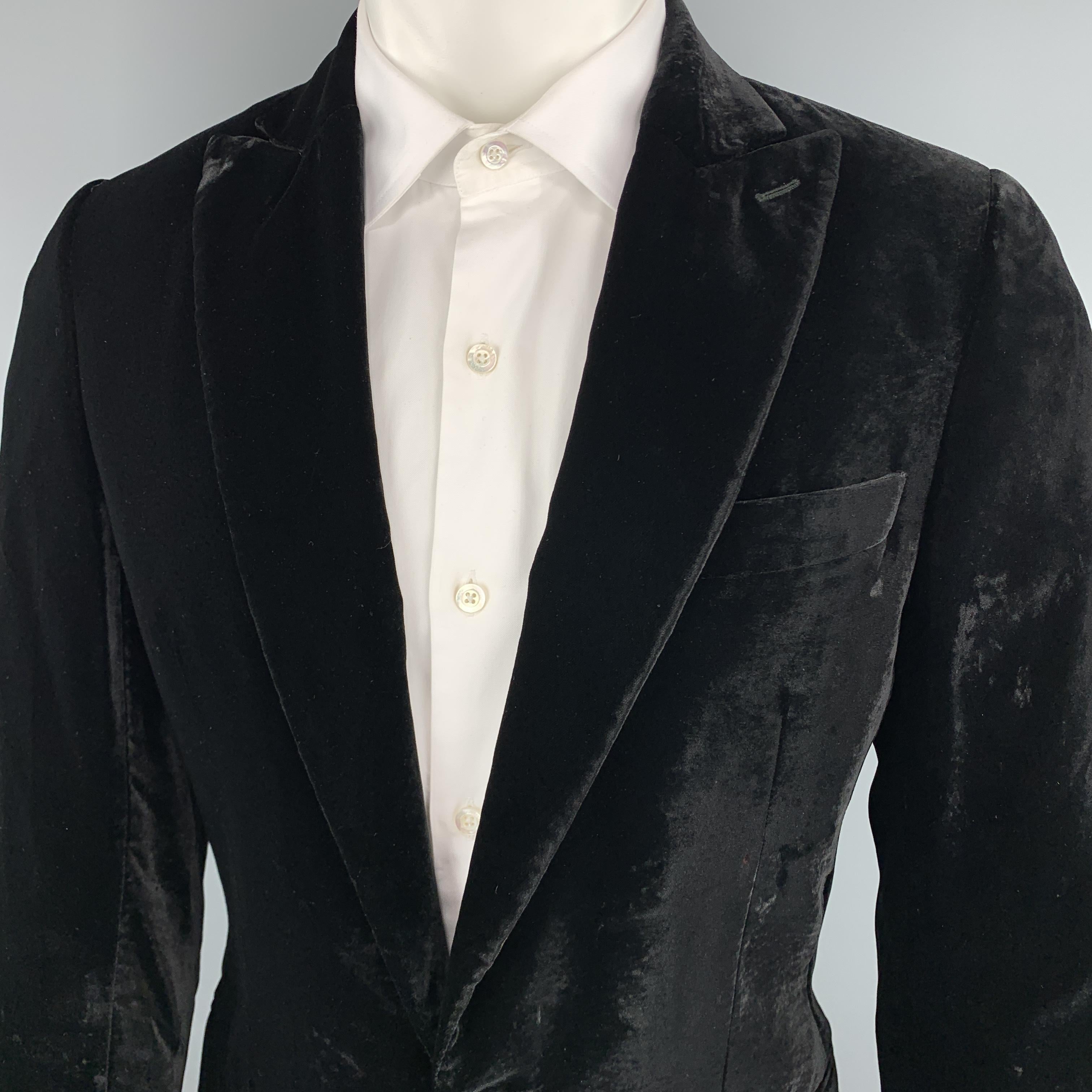 D&G by DOLCE & GABBANA sport coat comes in black velvet with a peak lapel, single breasted, two button front, and double vented back. Made in Italy.

Very Good Pre-Owned Condition.
Marked: IT 48

Measurements:

Shoulder: 17.5 in.
Chest: 42