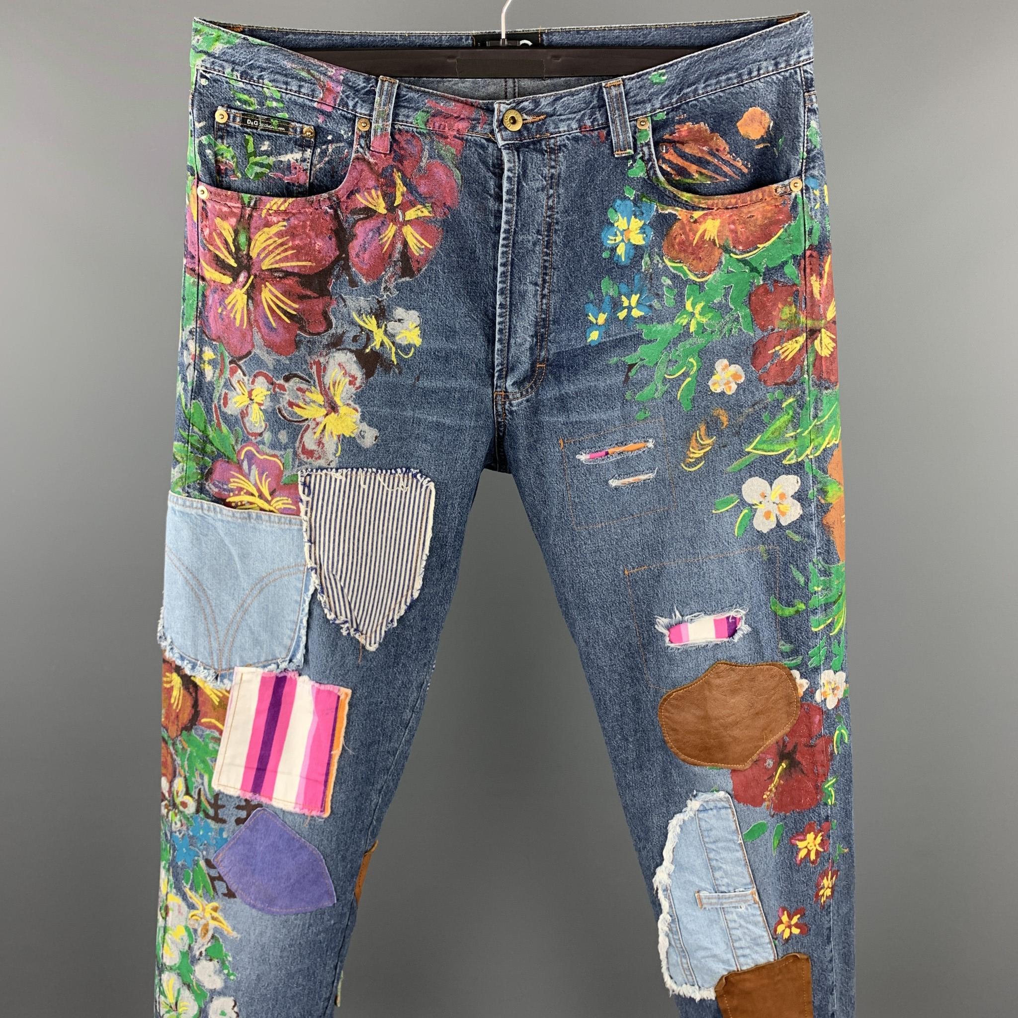 D&G by DOCLE & GABBANA jeans comes in a blue applique denim with painted floral designs featuring a regular fit and a button fly closure. Made in Italy.

Very Good Pre-Owned Condition.
Marked: 38/52

Measurements:

Waist: 38 in. 
Rise: 11 in.