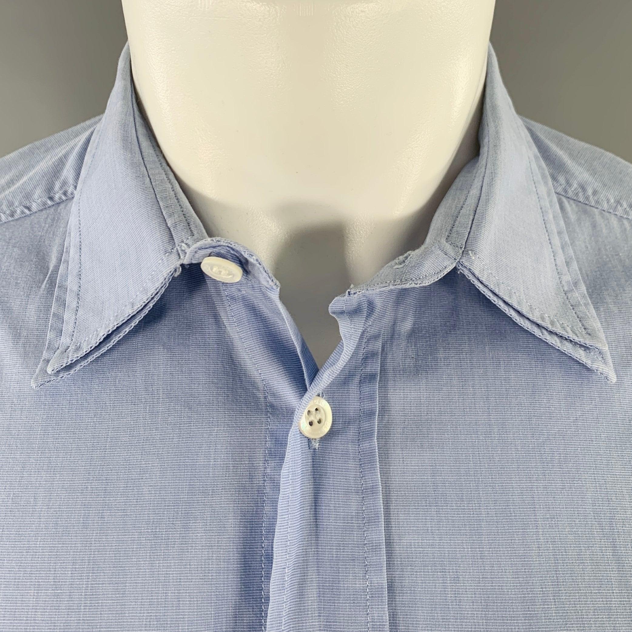 D&G by DOLCE & GABBANA long sleeve shirt
in a
blue woven fabric (feels like cotton) featuring a spread collar with double layered detail, one pocket, and button closure. Very Good Pre-Owned Condition. Minor signs of wear. Fabric tags removed.