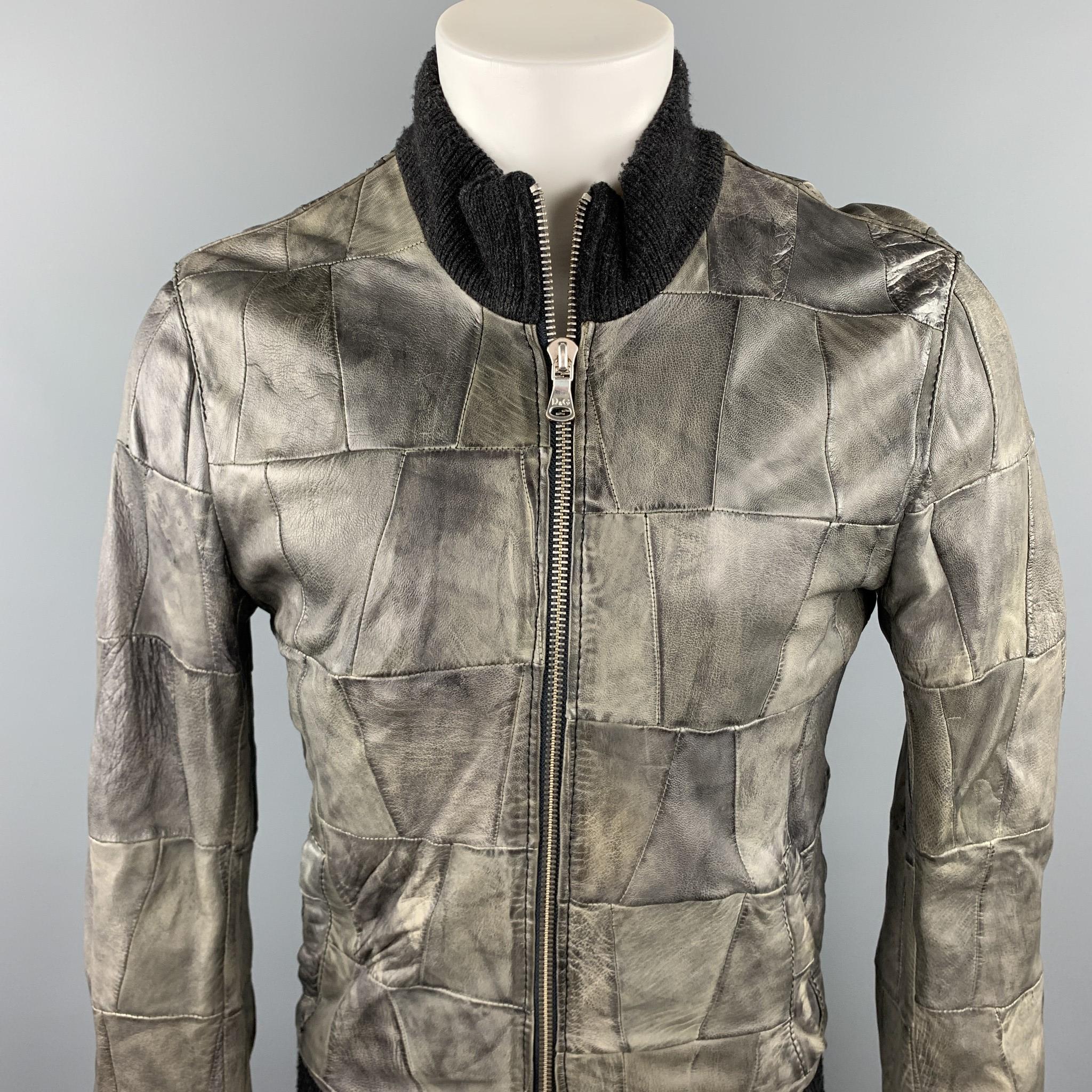 D&G by DOLCE & GABBANA jacket comes in a grey leather with patchwork details featuring a high collar, ribbed hem, and a zip up closure.

Very Good Pre-Owned Condition.
Marked: 48
Original Retail Price: $1,345.00

Measurements:

Shoulder: 18.5 in.