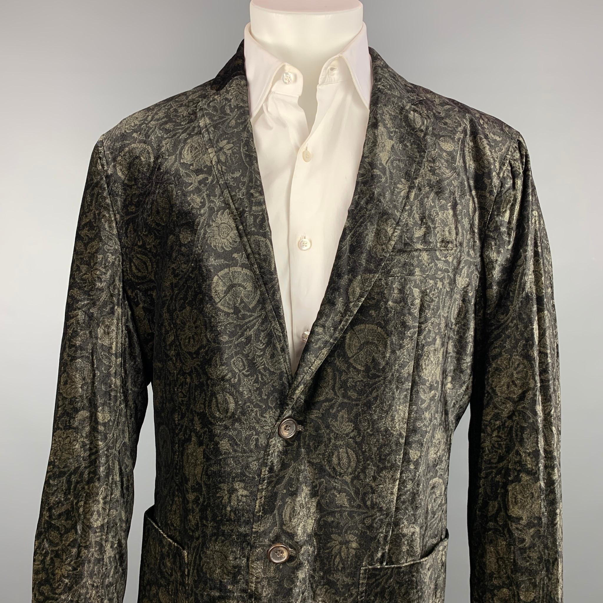D&G by DOLCE & GABBANA sport coat comes in a black & gold velvet with a full monogram liner featuring a notch lapel, patch pockets, and a two button closure.

Good Pre-Owned Condition.
Marked: 50

Measurements:

Shoulder: 20 in.
Chest: 44