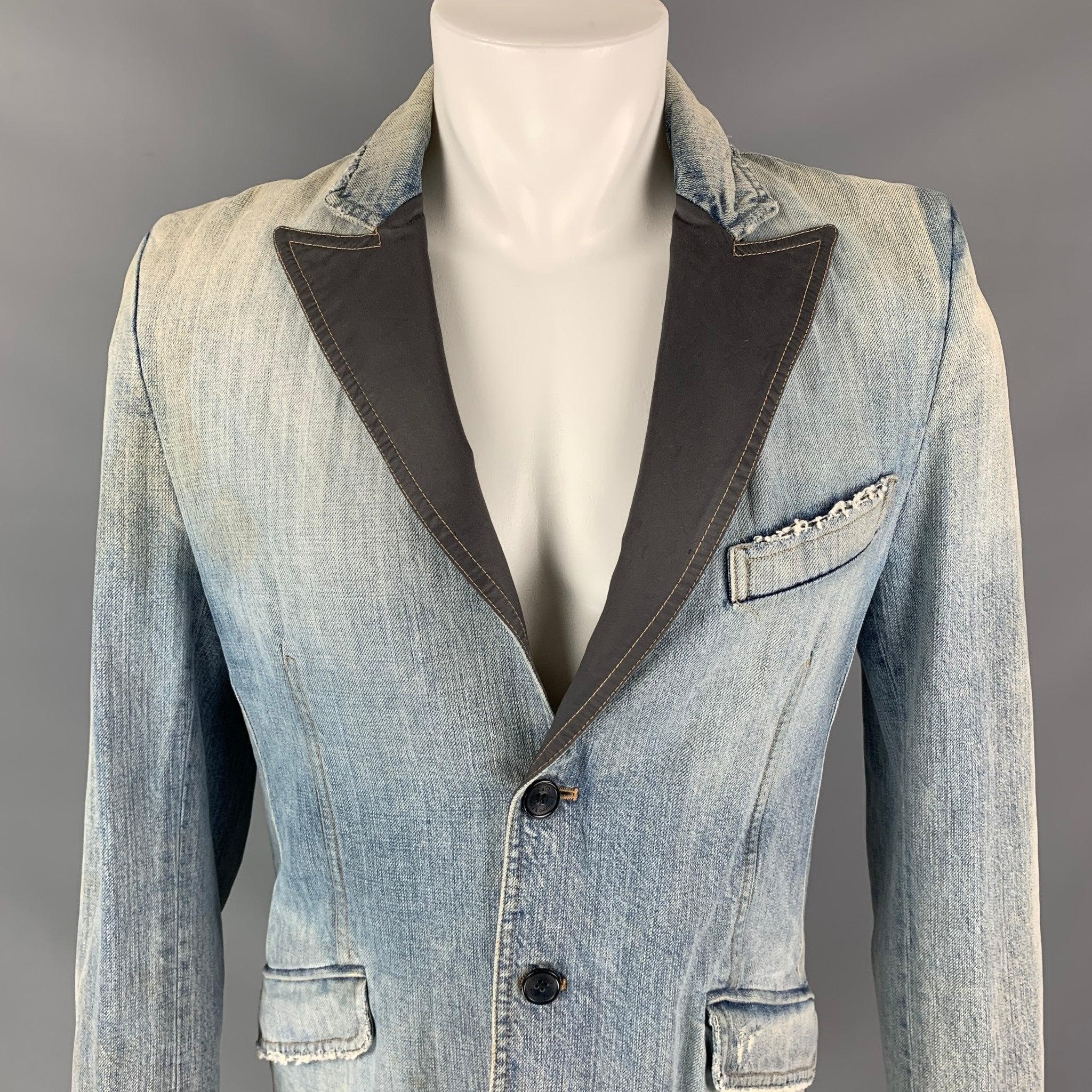 D&G by DOLCE & GABBANA jacket comes in a blue distressed denim with a full liner featuring a gray peak lapel, single back vent, flap pockets, and a two button closure. Made in Italy.
Good
Pre-Owned Condition. 

Marked:   36/50 

Measurements: 
