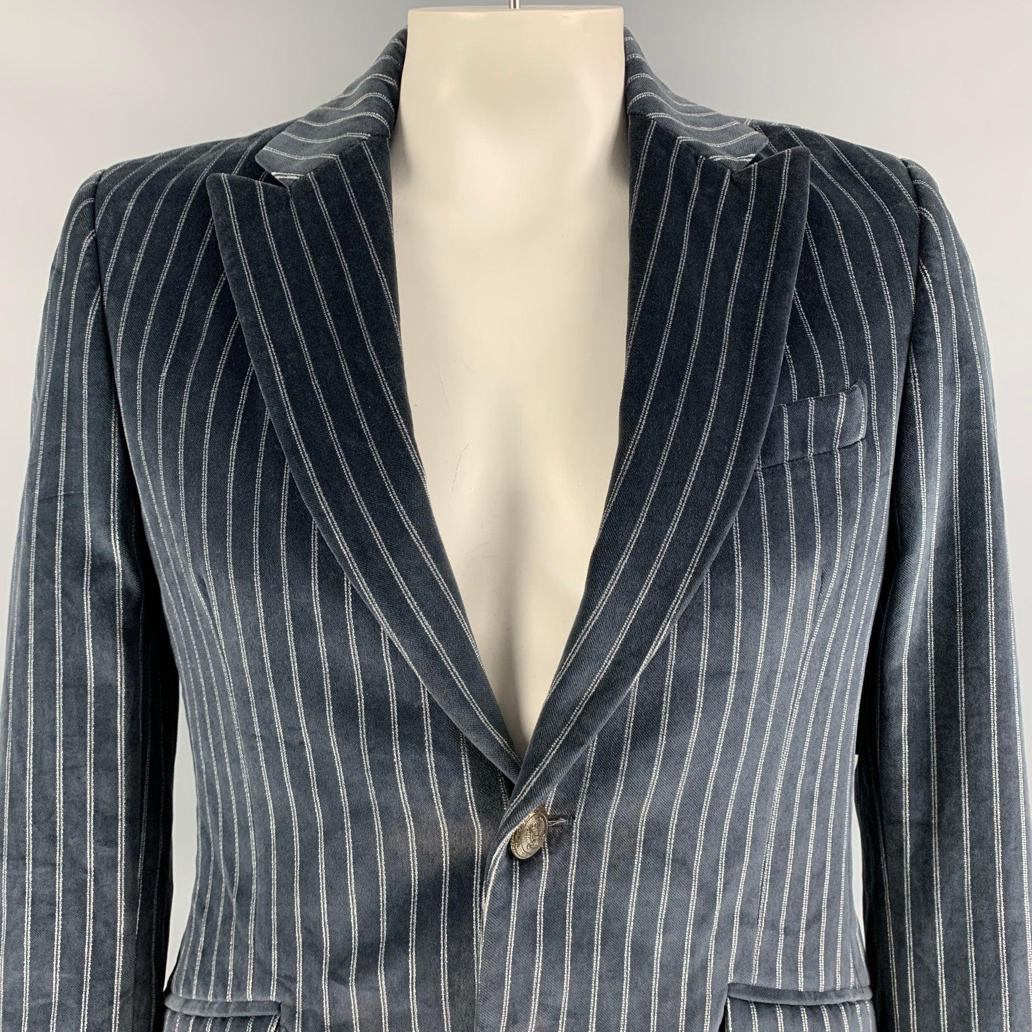 D&G by DOLCE & GABBANA long sleeve sport coat comes in grey velvet striped print features a two button closure, straight with flap pockets and notch lapel. Made in Italy. Excellent Pre-Owned Condition. 

Marked:   50 IT 

Measurements: 
 
Shoulder: