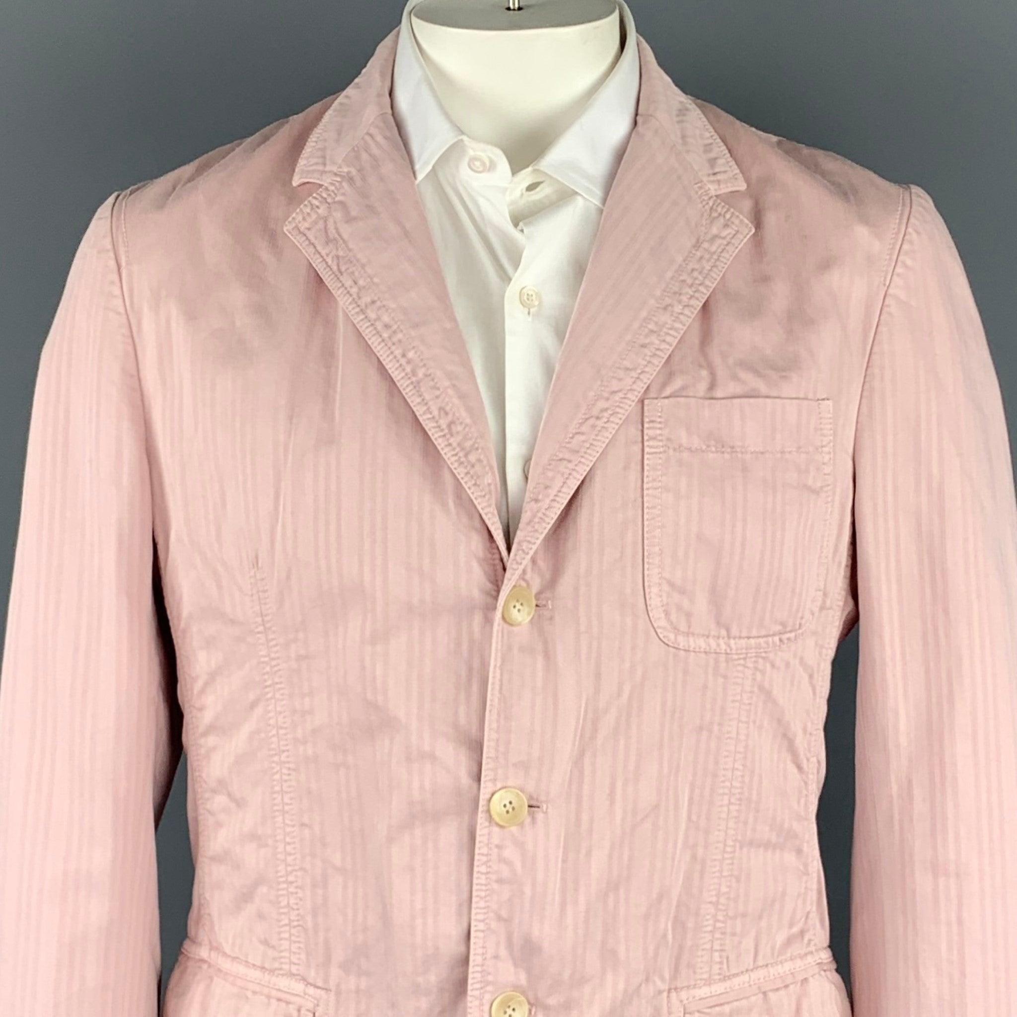 D&G by DOLCE & GABBANA sport coat comes in a rose stripe cotton featuring a notch lapel, flap pockets, and a thress button closure. Made in Romania.Very Good
Pre-Owned Condition. 

Marked:   38/52 

Measurements: 
 
Shoulder: 18 inches  Chest: 40