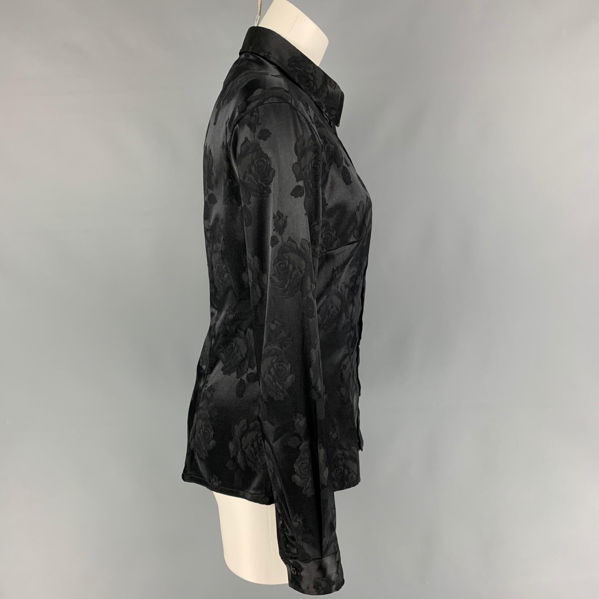 D&G by DOLCE & GABBANA shirt comes in a black jacquard polyester featuring a spread collar and a button up closure. Made in Italy. 

Very Good Pre-Owned Condition.
Marked: 30/44

Measurements:

Shoulder: 17 in.
Bust: 36 in.
Sleeve: 25 in.
Length: 25