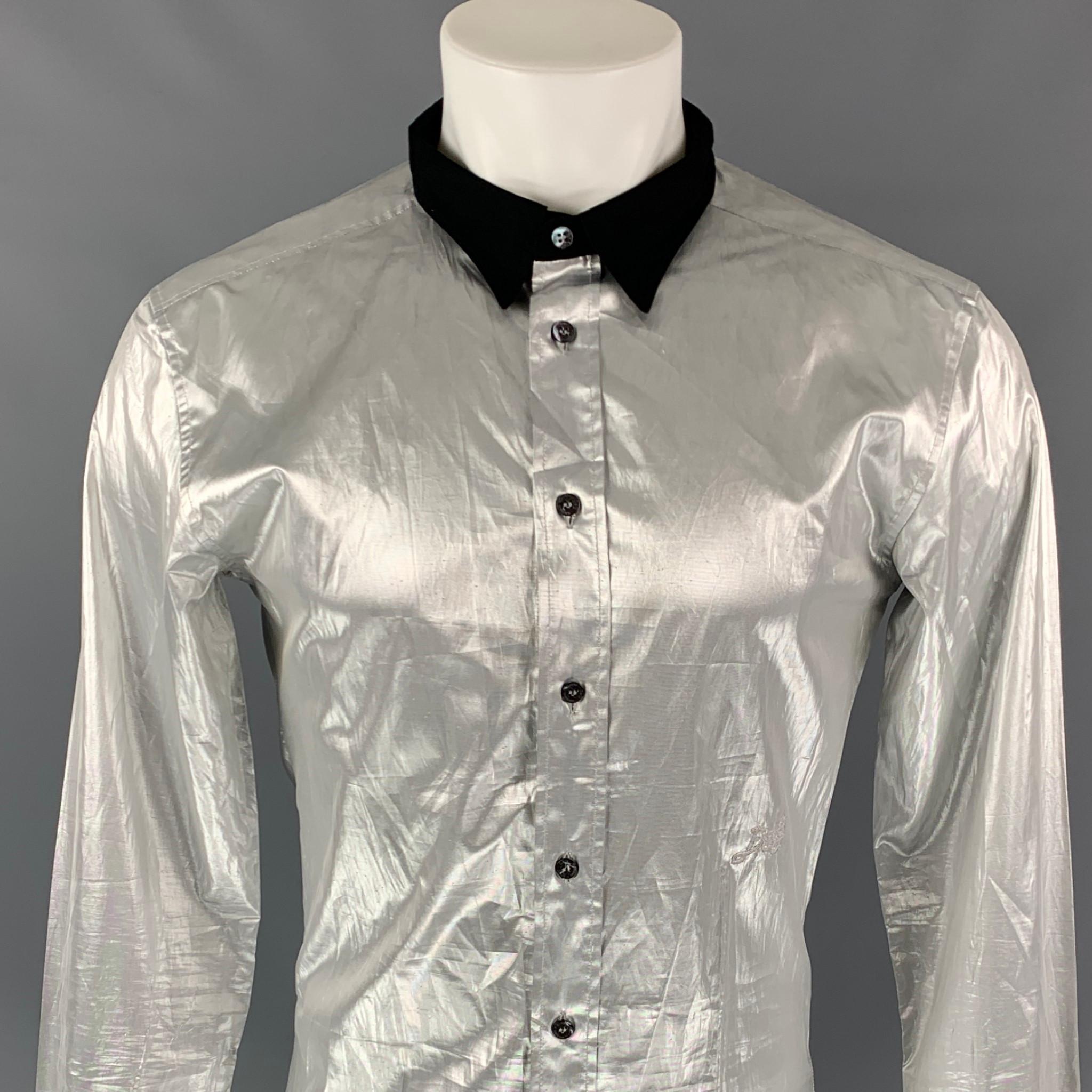 D&G by DOLCE & GABBANA long sleeve shirt comes in a silver metallic material featuring a slim fit, embroidered logo detail, black spread collar, and a button up closure. Made in Italy.

Very Good Pre-Owned Condition. Fabric tag removed.
Marked: Size