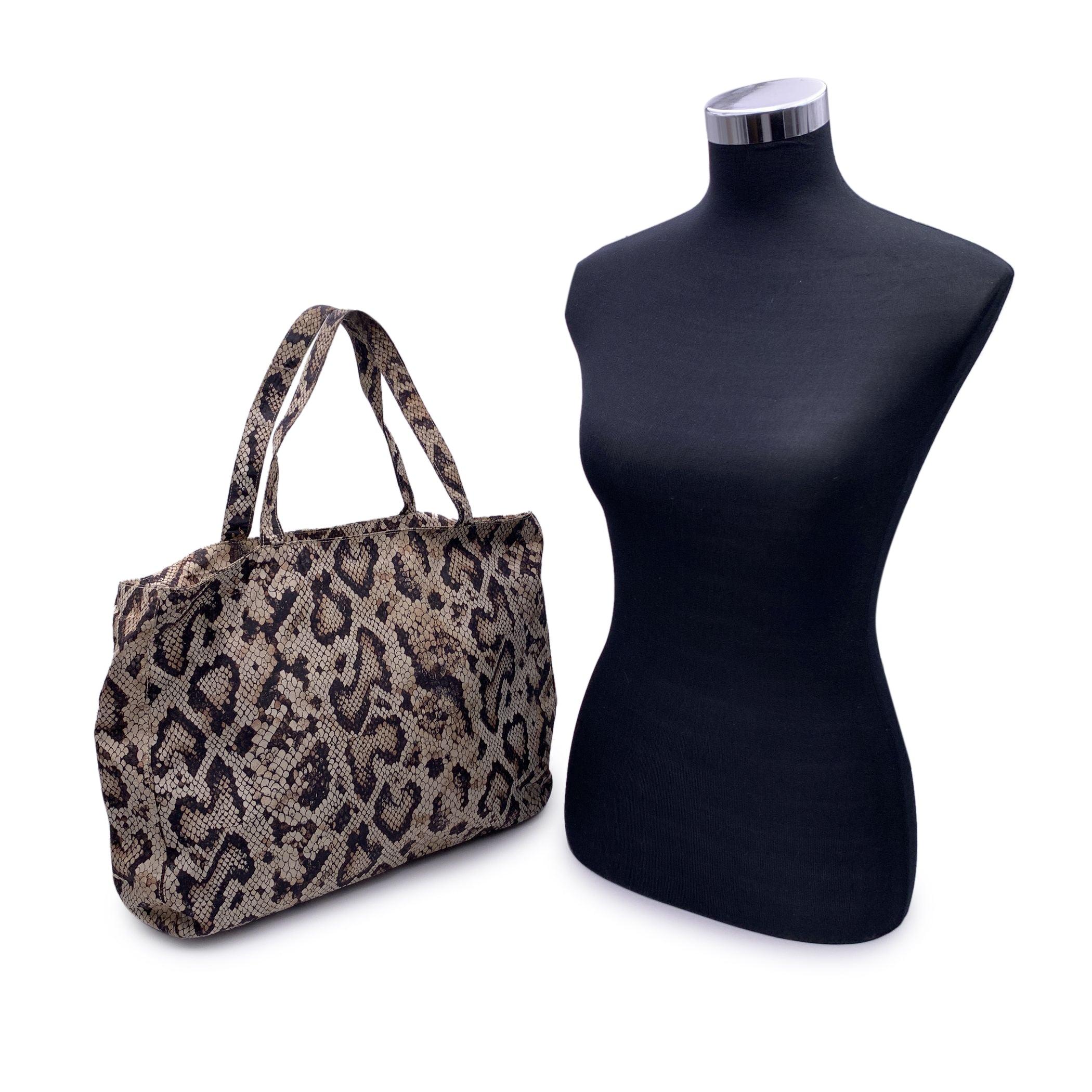 D&G Dolce & Gabbana tote bag in beige and brown nylon with snakeskin print. Upper zipper closure. Brown lining. 1 side zip pocket inside. 'D&G Dolce & Gabbana - Made in Italy' tag inside Condition A - EXCELLENT Gently used. Minimal