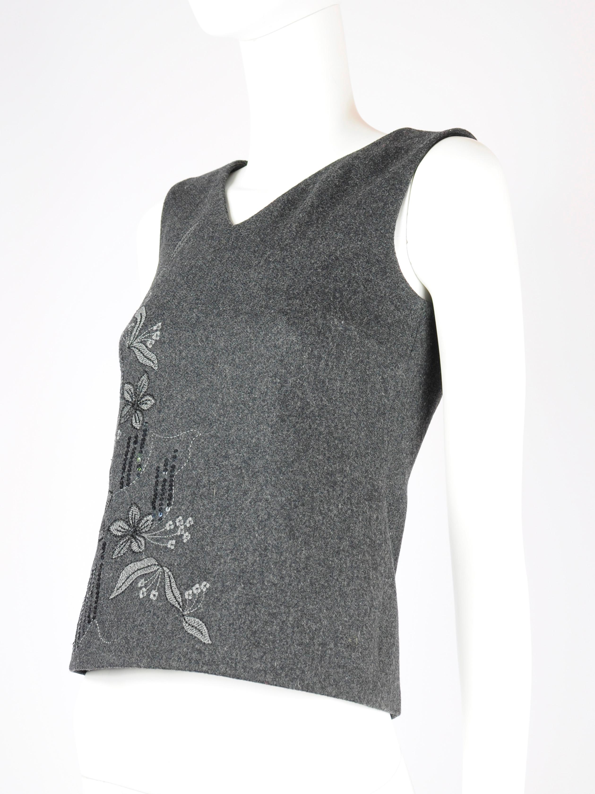 Dolce & Gabbana D&G vintage sleeveless top, new with tags/ deadstock. This dark grey embroidered top by D&G features a V-neck and a zipper that goes all the way down the back. There’s a floral embroidery on the front with some sequin details as