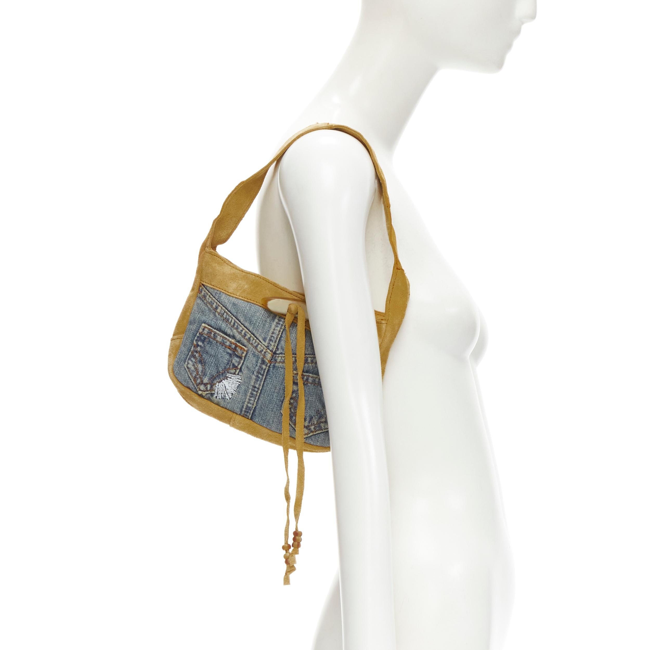 D&G DOLCE GABBANA Vintage Y2K distressed denim suede mini shoulder bag
Brand: D&G
Designer: Domenico Dolce and Stefano Gabbana
Material: Suede
Color: Blue
Pattern: Solid
Closure: Magnet
Made in: Italy

CONDITION:
Condition: Fair, this item was