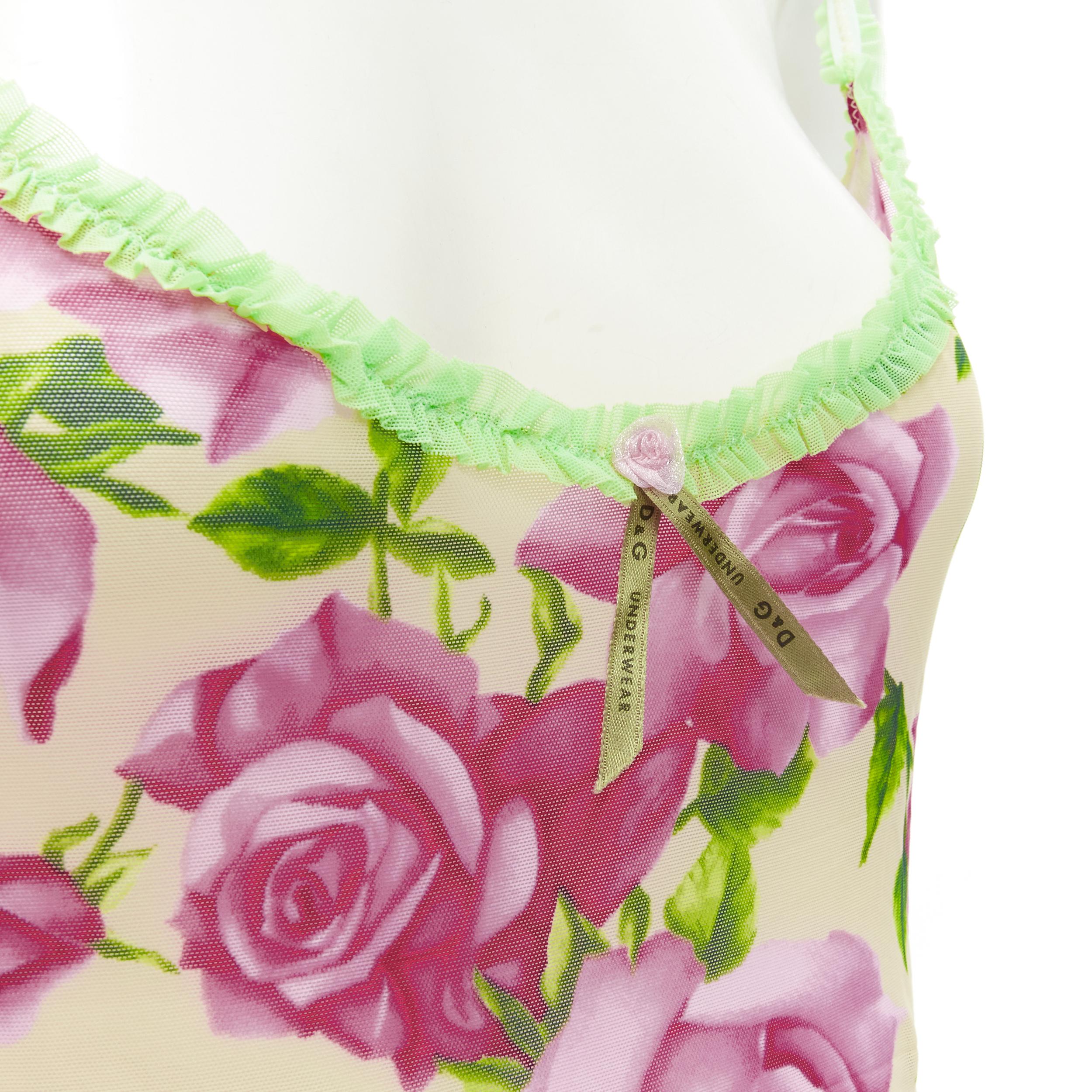 D&G DOLCE GABBANA Vintage Y2K pink rose green ruffle trim cami tank top XS 
Reference: ANWU/A00605 
Brand: D&G 
Material: Feels like polyester 
Color: Pink 
Pattern: Floral 
Extra Detail: Adjustable shoulder strap. Green tulle ruffle shoulder strap.
