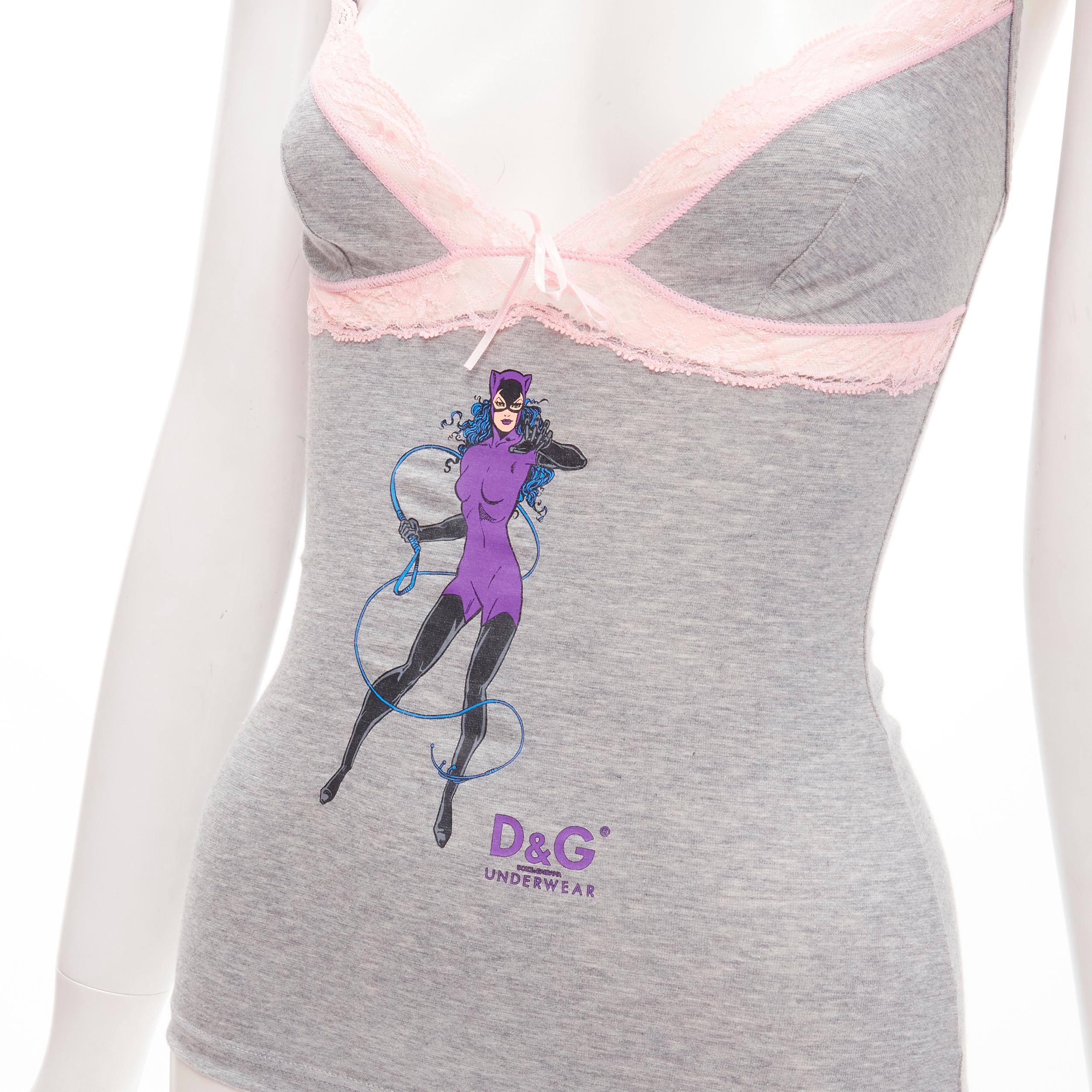 D&G DOLCE GABBANA Y2K Vintage grey Catwoman pink lace cami tank top XS 
Reference: ANWU/A00606 
Brand: D&G 
Material: Cotton 
Color: Grey 
Pattern: Solid 
Extra Detail: Adjustable shoulder strap. Catwoman print at front. Sheer lace panel trimming.
