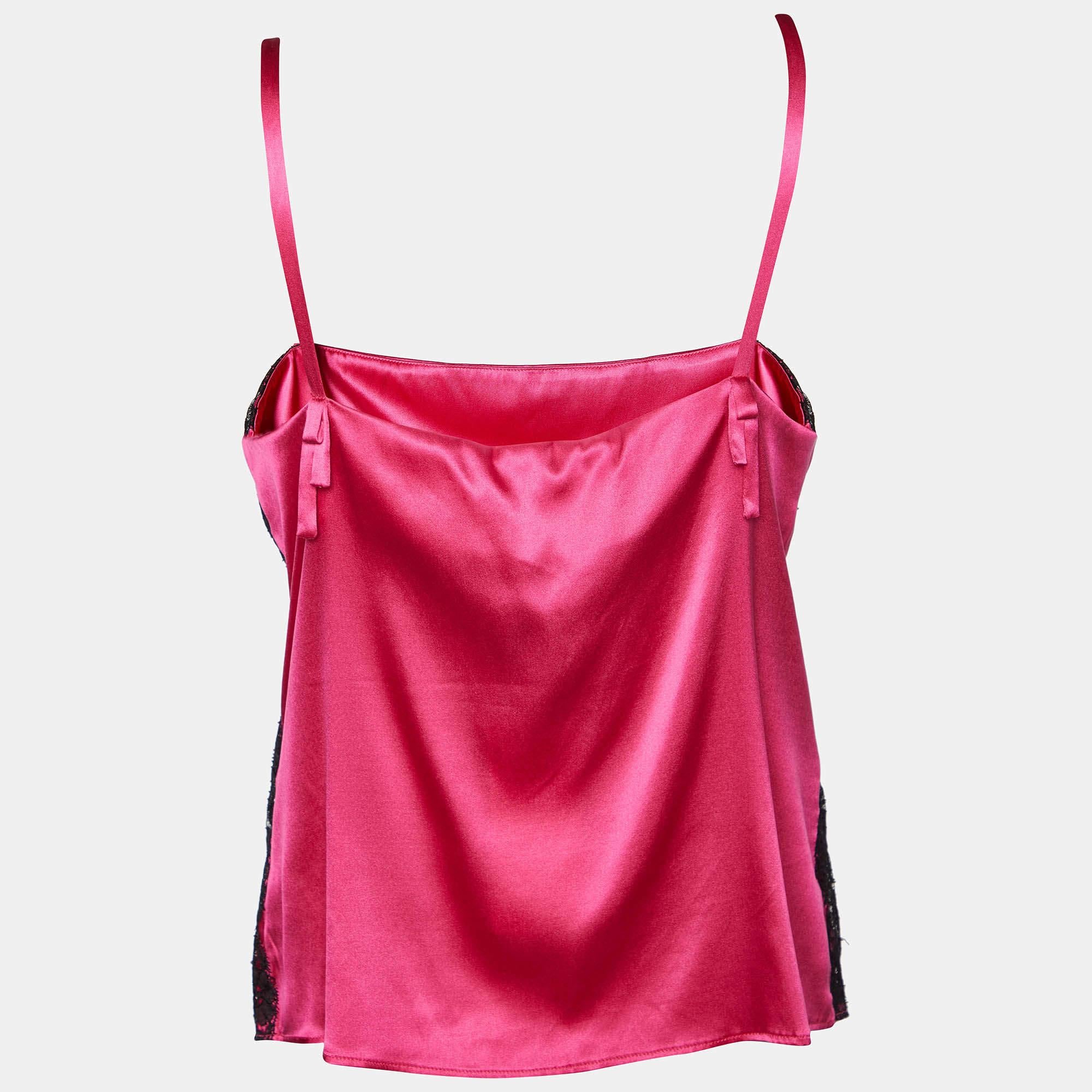 The D&G camisole is an exquisite lingerie piece featuring vibrant fuschia pink silk satin with delicate lace detailing. Its elegant design offers a sensuous and luxurious feel, making it a perfect choice for intimate occasions.

