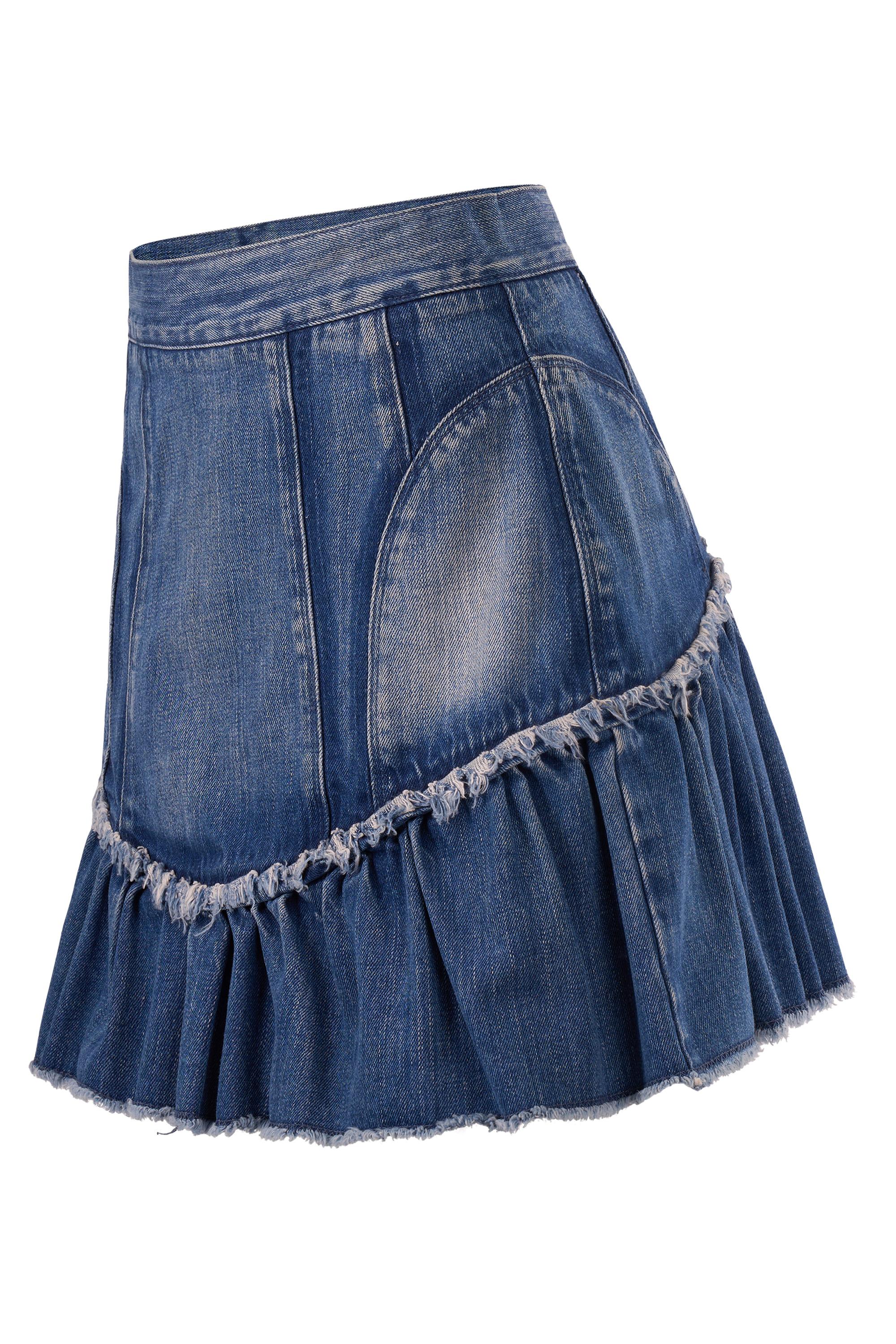 D&G S/S 2010 ruffle denim mini skirt . Features a high-waisted silhouette, structured paneling and voluminous gathered ruffles along the hemline, frayed trim for a deconstructed edge. Fading and whiskers throughout the mid-blue wash. Fastens with a