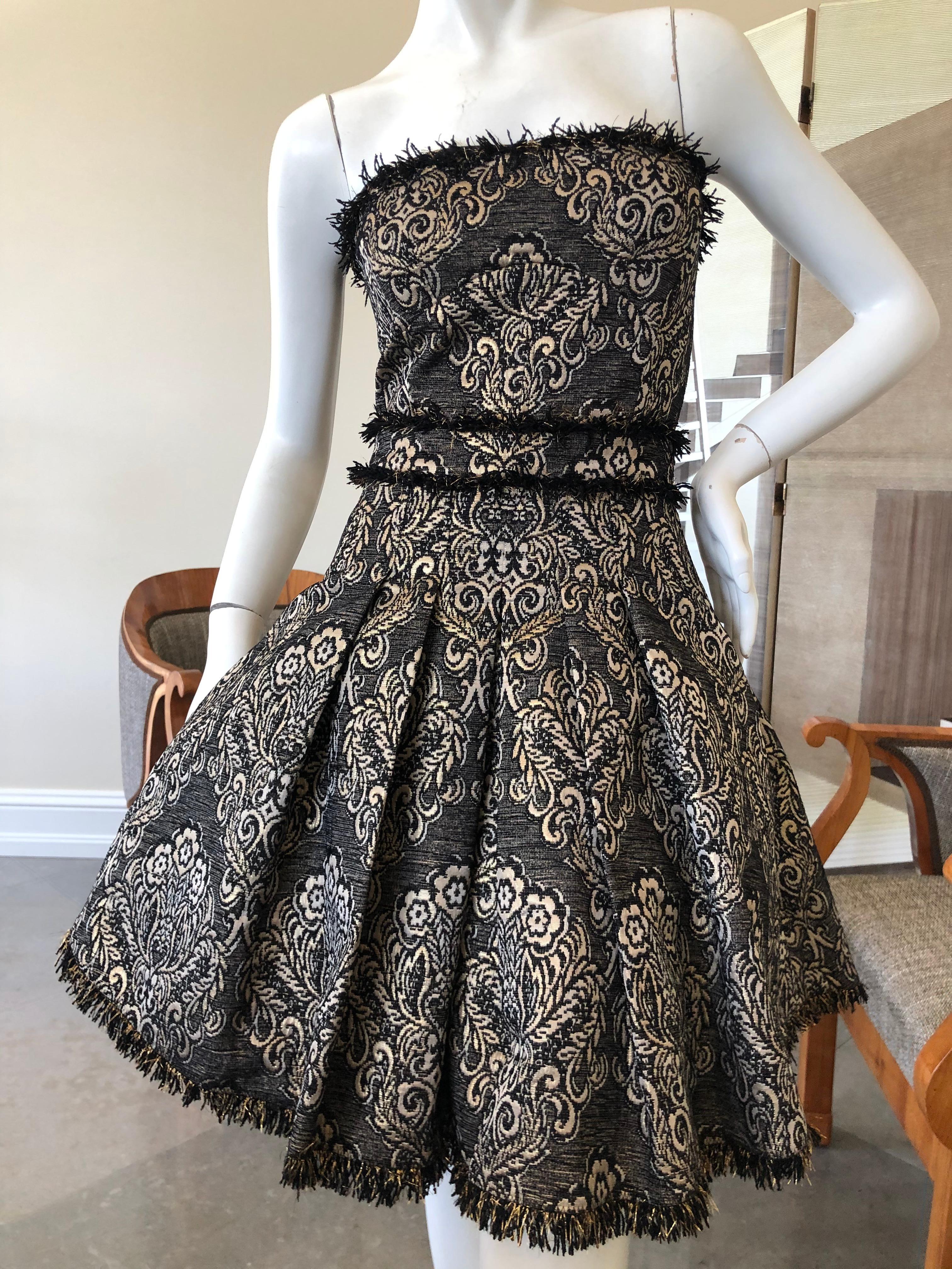 Dolce & Gabbana for D&G Strapless Mini Ball Gown with Full Corset & Petticoats.
This is so sweet, like a mini ball gown in a baroque pattern that has a lot of gold and silver.
 Zips up the back
This is so wonderful, so sexy. the photos don't do it