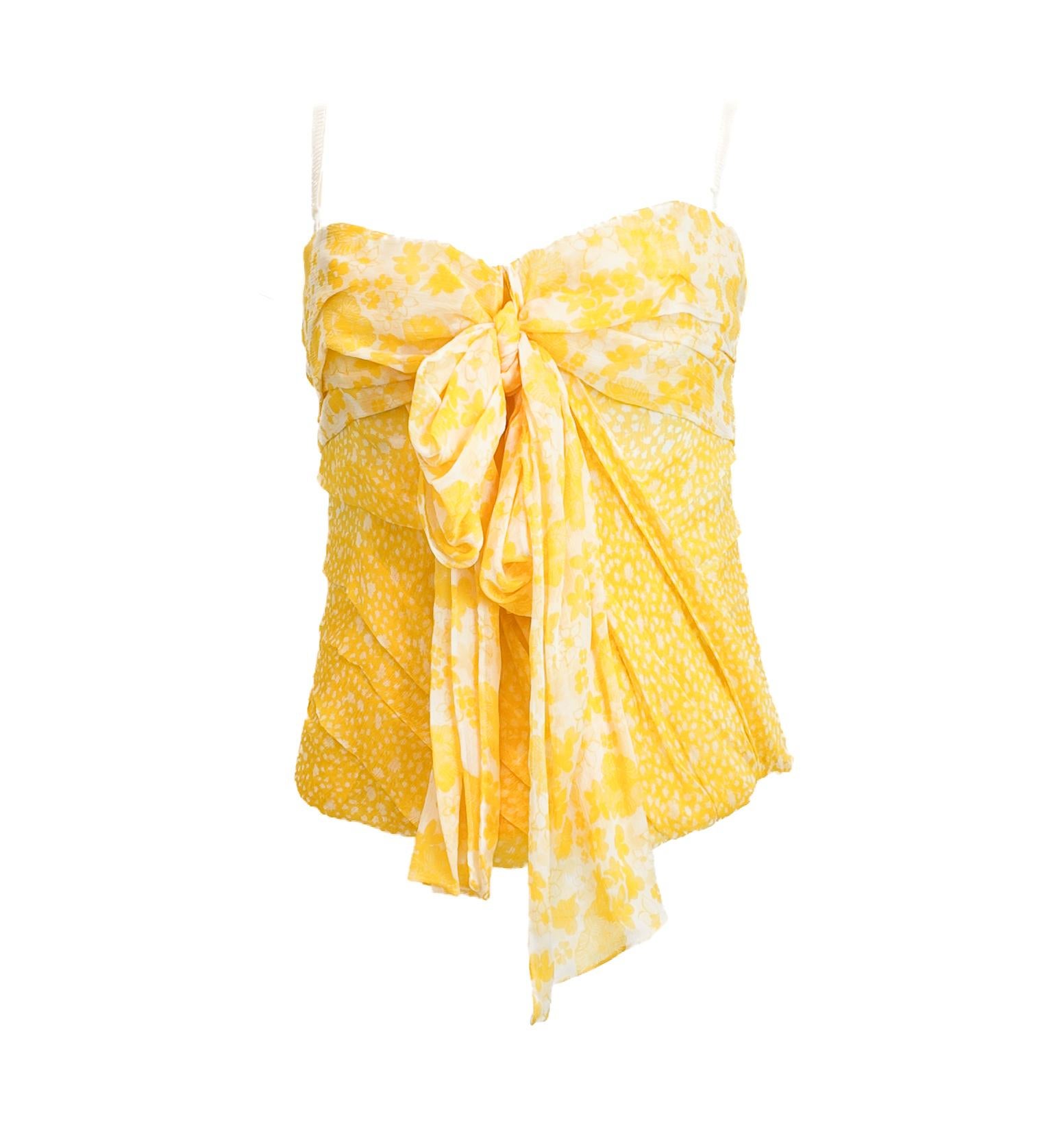 Ce corset en mousseline froncée imprimée jaune de D.G. est un choix élégant pour les occasions sophistiquées de la journée. Confectionné en mousseline de soie délicatement froncée, il se drape joliment pour mettre en valeur votre silhouette. Le
