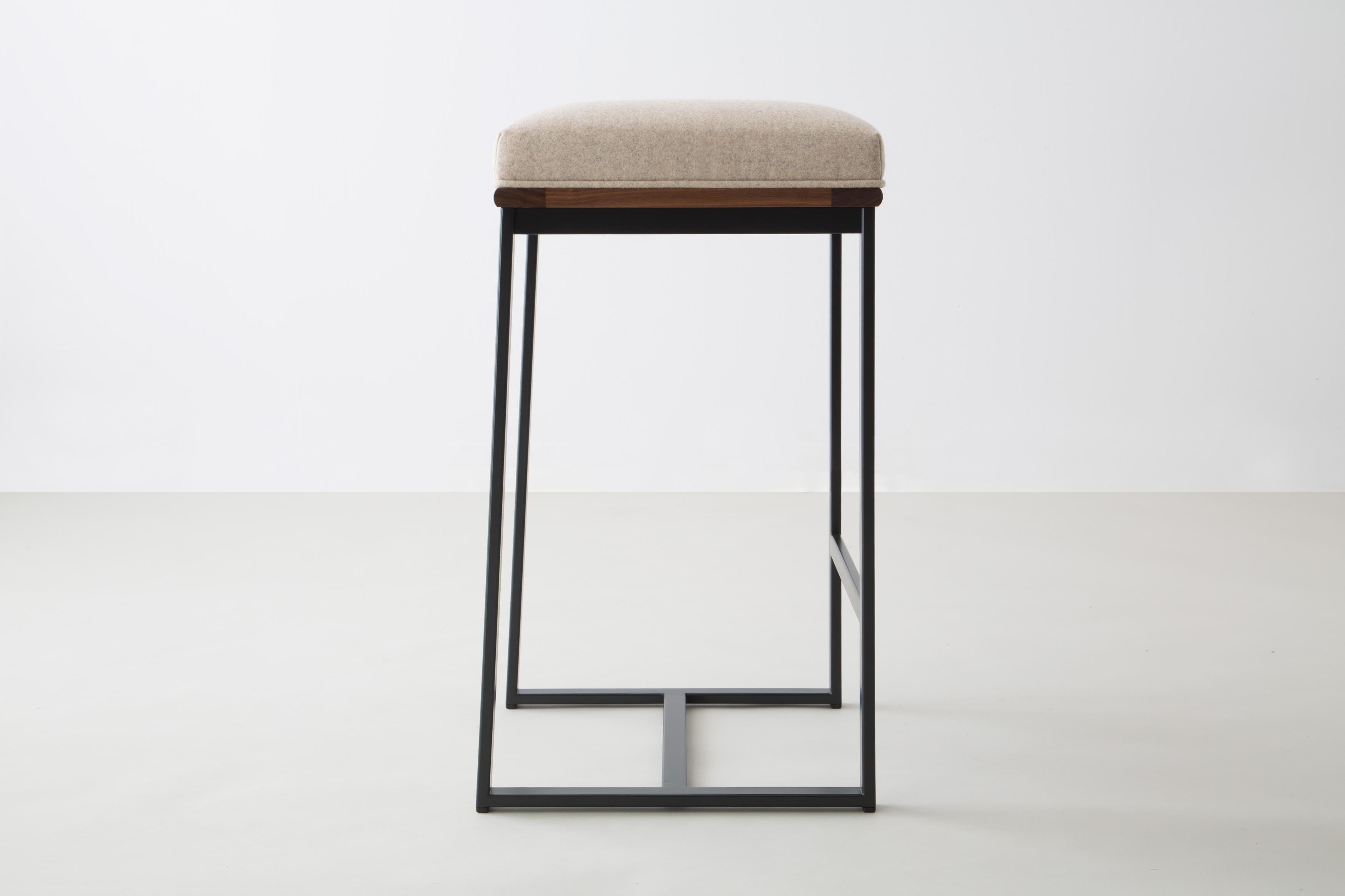 The DGD counter stool finds formality and comfort in the industrial and organic.
 
Seat frame shown in walnut and available ash, cherry, maple, or white oak

Powder coated steel frame shown in black/grey and available in any standard RAL colors.