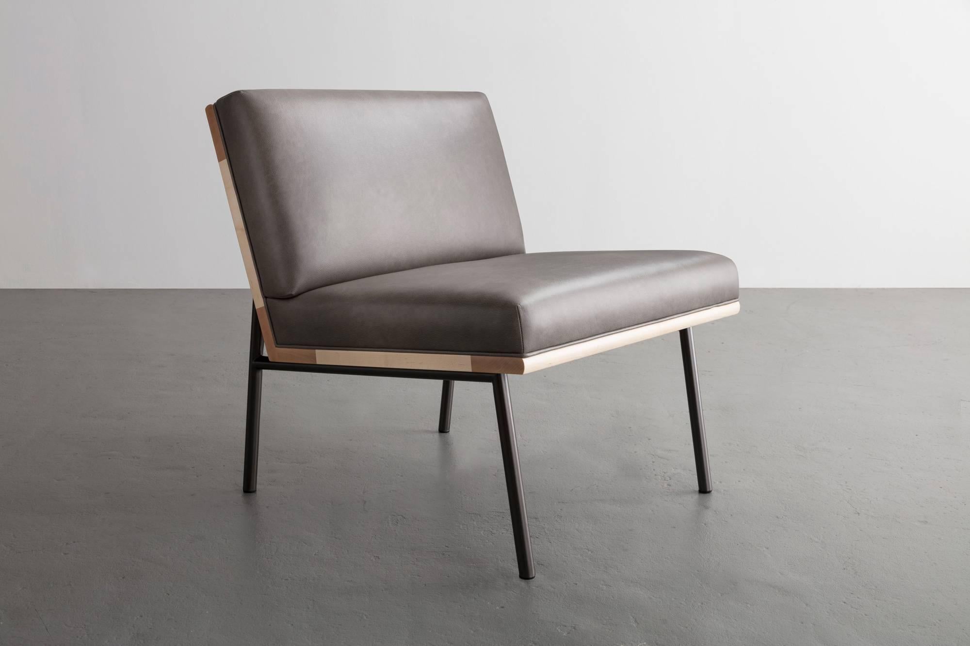 Thoughtful consideration in materials and transitions make this chair a skillful edit and perfect balance.
 
Seat frame shown in maple and available in ash, walnut, and  white oak. 
Steel legs shown in black nickel plated or available in powder coat